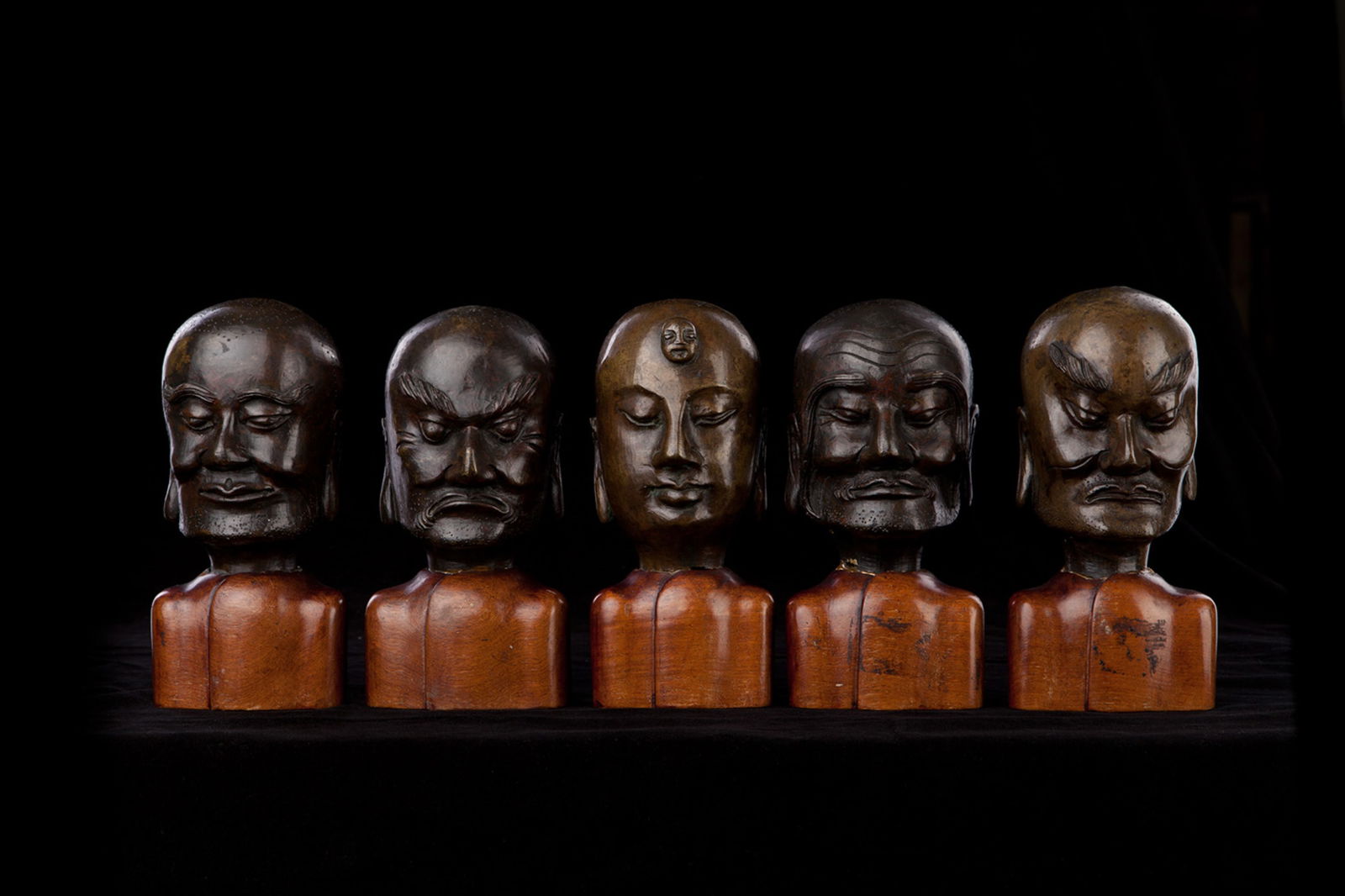 Five Chinese Bronze Lohan Heads (Ming/Early Qing), Expressive and Well Cast: Set of Five 17th/18th Century (or Earlier) Bronze Lohan Heads. A rare and beautifully cast group of five Lohan (Arhat) heads, dating to the 17th–18th century or earlier. Each head measures approxima
