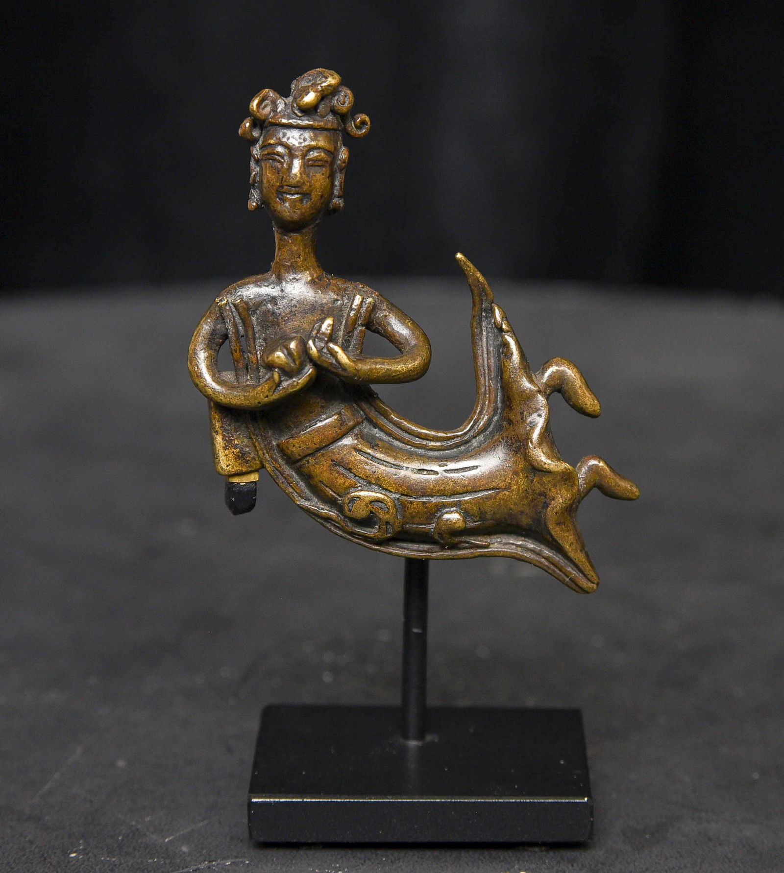 5th/6thC Pre-Tang Bronze Buddhist "Angel" From an Early Large Buddha Backplate: Early Chinese Bronze Buddhist “Angel,” Pre-Tang, 5th–6th Century From a Large and Elaborate Altar Back-Plate. This remarkably expressive early Chinese bronze “angel” comes from a lar