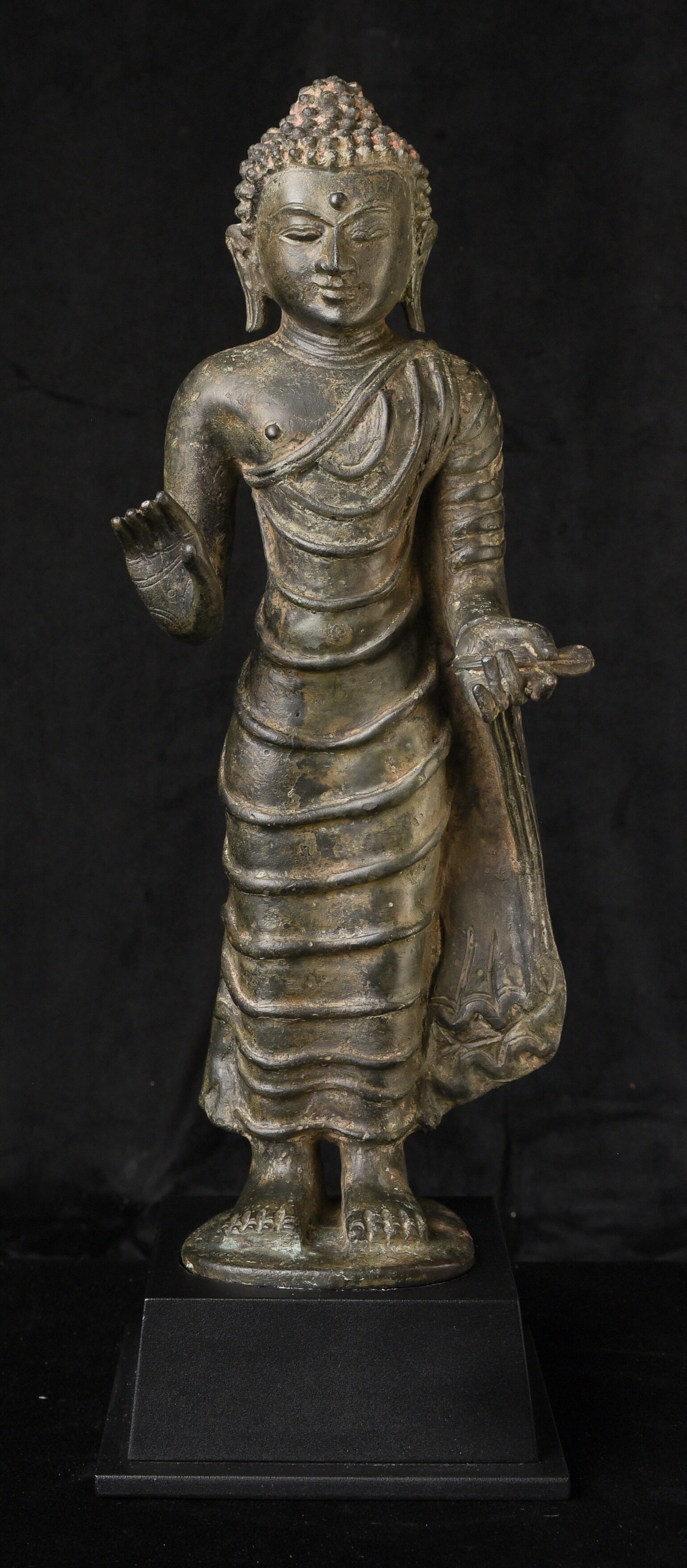 13thC Burmese Buddha Pagan Buddha with Ava Influence. Formidable, Charismatic: Striking 13th Century Standing Burmese Bronze Buddha Late Pagan Style with Early Ava Influences. This powerful and thickly cast 13th-century Burmese standing Buddha represents a late Pagan-period aest