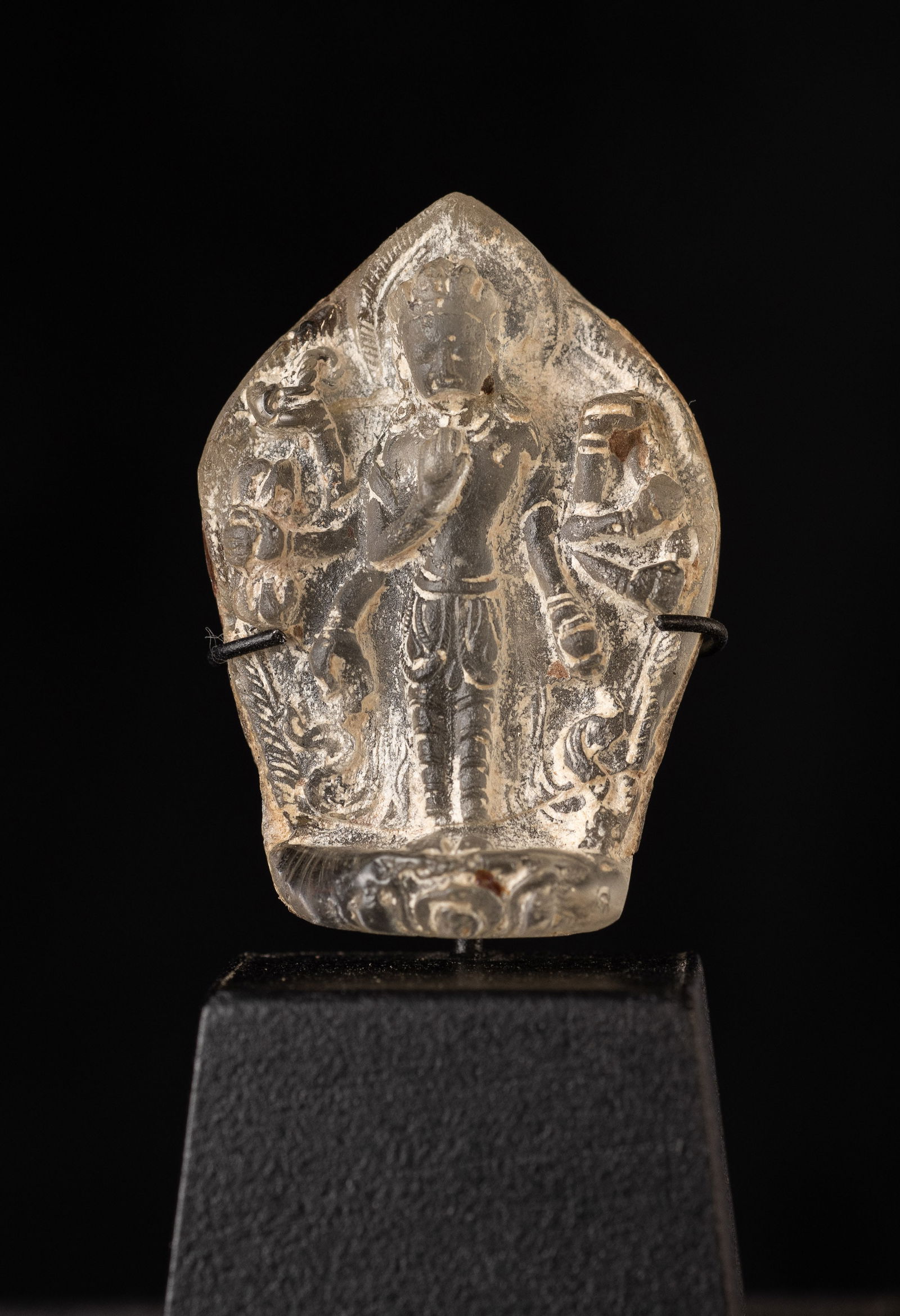 Very rare 10/11thC Cambodian Glass Multi-Arm Tantric Deity. Has a custom stand.: Very rare 10/11thC Cambodian Glass Multi-Arm Tantric Deity. Has a custom stand. I've seen only three of these in 20+ years. (1.5"H x 1"W x .375"D)-25g. / Base: 1"H x 1.25"W)