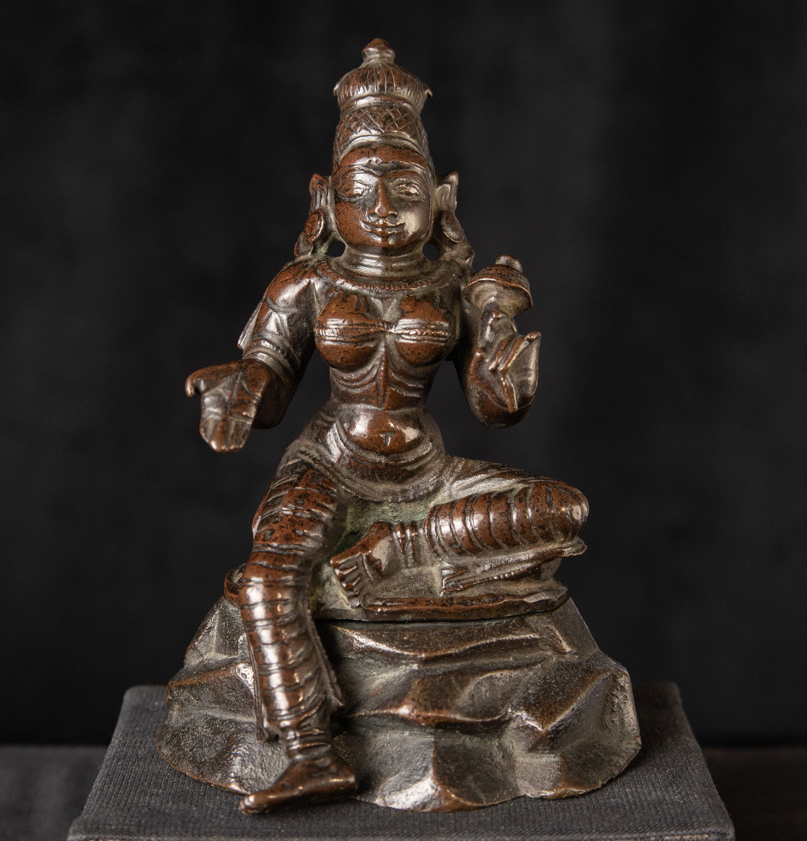 Very fine antique Hindu bronze on an unusual solid cast base.: Very fine antique Hindu bronze on an unusual solid cast base. There is a modern hole drilled through the base which is not visible when assembled. Cast in a high quality bronze and heavy (5"H x 3.25"W