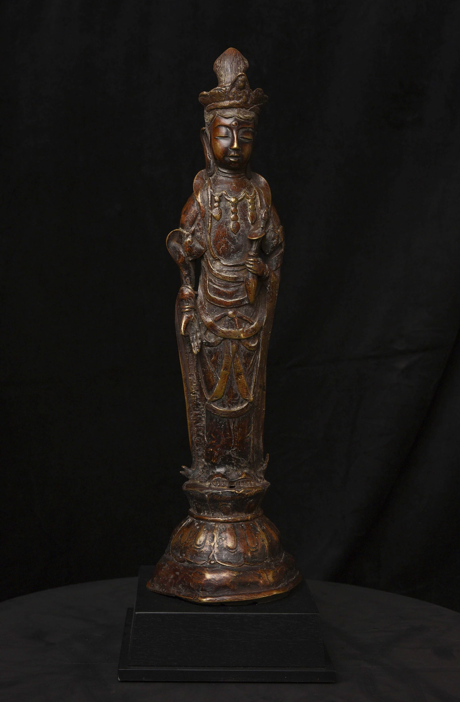 Large 19thC Korean Standing Buddha/Bodhisattva of Compassion.: Large 19thC Korean Standing Buddha/Bodhisattva of Compassion. Cast out of high-quality alloy. The figure shows a high amount of wear from use, with the patina suggesting it may have precious metal in
