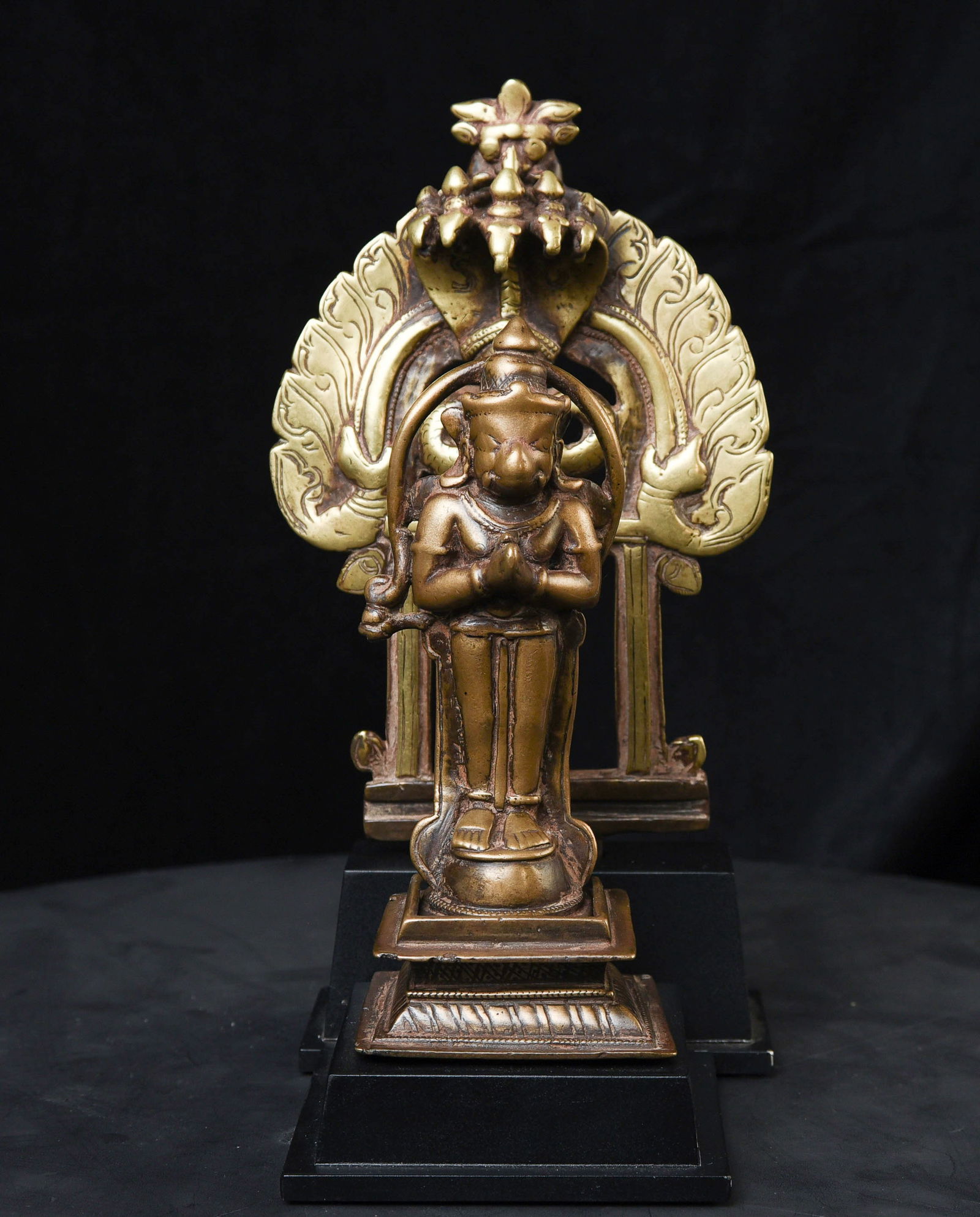 18thC Hanuman protected by nagas.-Very hard to find with original base+ backplate.: Wonderful 18thC Hanuman protected by nagas. Stands 8.75 inches tall. The widest point is 5-1/8 inches. Purchased by the previous owner from a well-known New York dealer in the 1960s. Note the addition