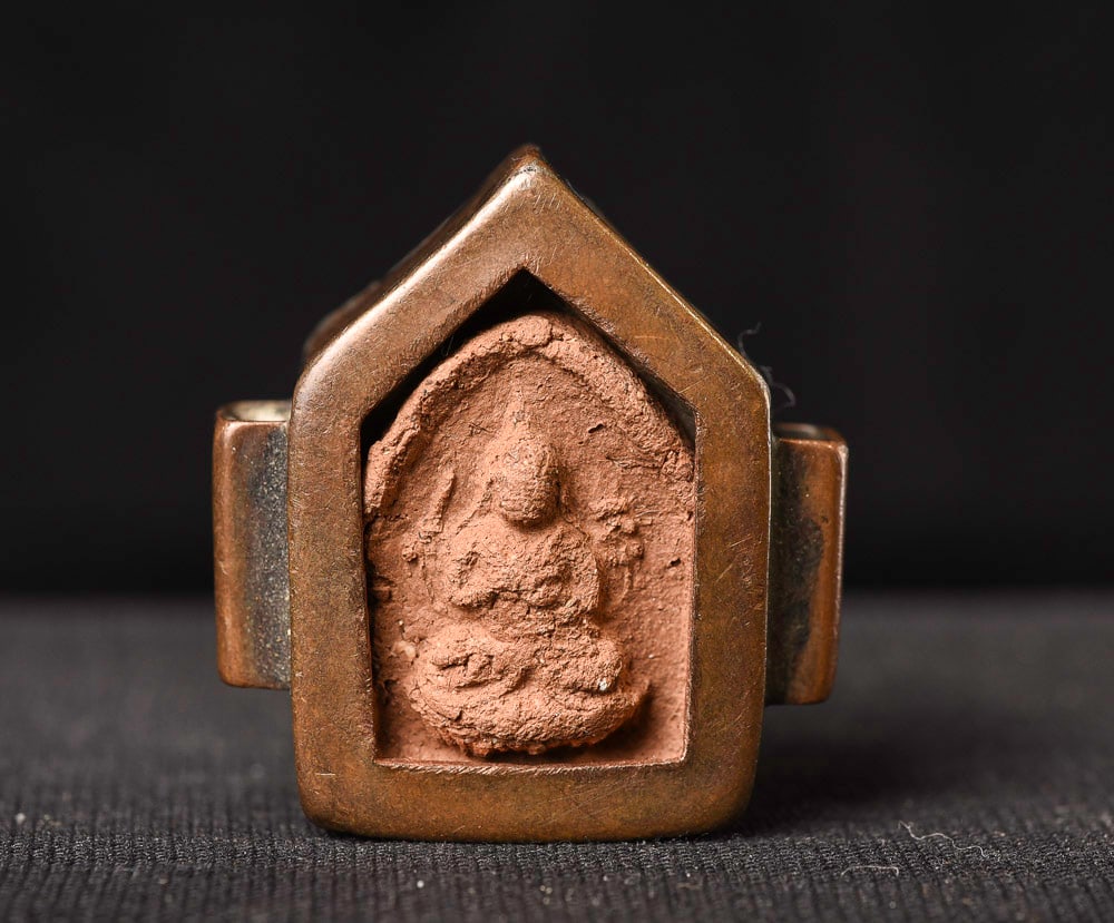 Very old Tibetan clay Buddha in an old Gau box.: Ancient Tibetan clay Buddha in an old Gau box. Probably 19thC. 1 1/8" tall, 1/2" deep, .75" wide. Deep discount