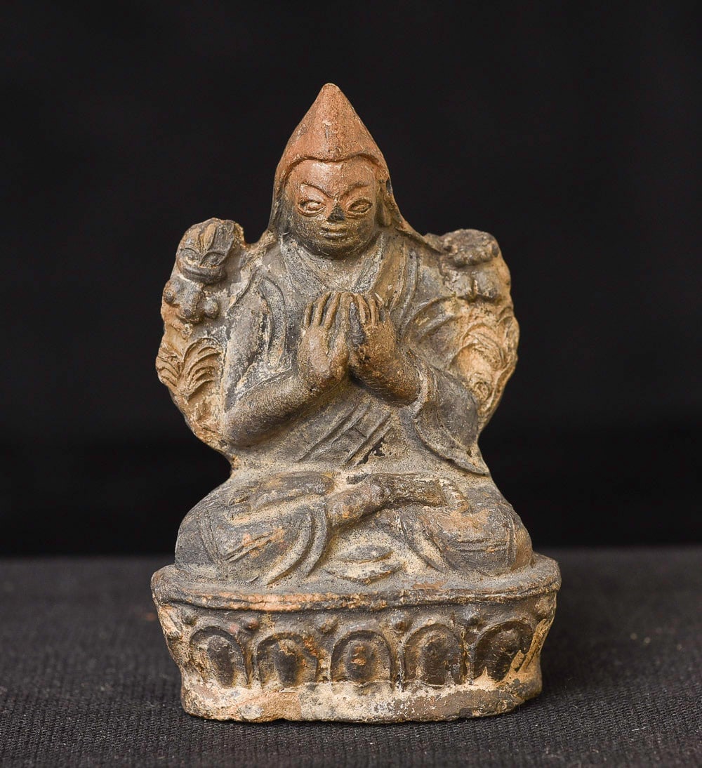 19thC/earlier Clay Tibetan or Mongolian Tsong Ka Pa: 19thC/earlier clay Tibetan or Mongolian Tsong Ka Pa is 2.25" tall. Bought out of a large collection of small Himalayan put together in the 1960s and 70sly 19thC. 1 1/8" tall, 1/2" deep, .75" Deep