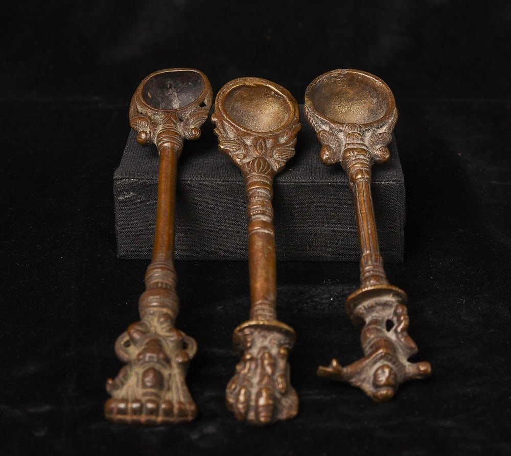 Three cast 18/19thC Indian Hindu bronze ritual spoons for one bid.: Three cast 18/19thC Indian Hindu bronze ritual spoons for one bid ( A,B,C - From Left to right ) A: 5.75" x 1.375" - 120g, B: 6"x 1.25" - 115g, C: 6.125" x 1.375" - 125g. Deep Discount