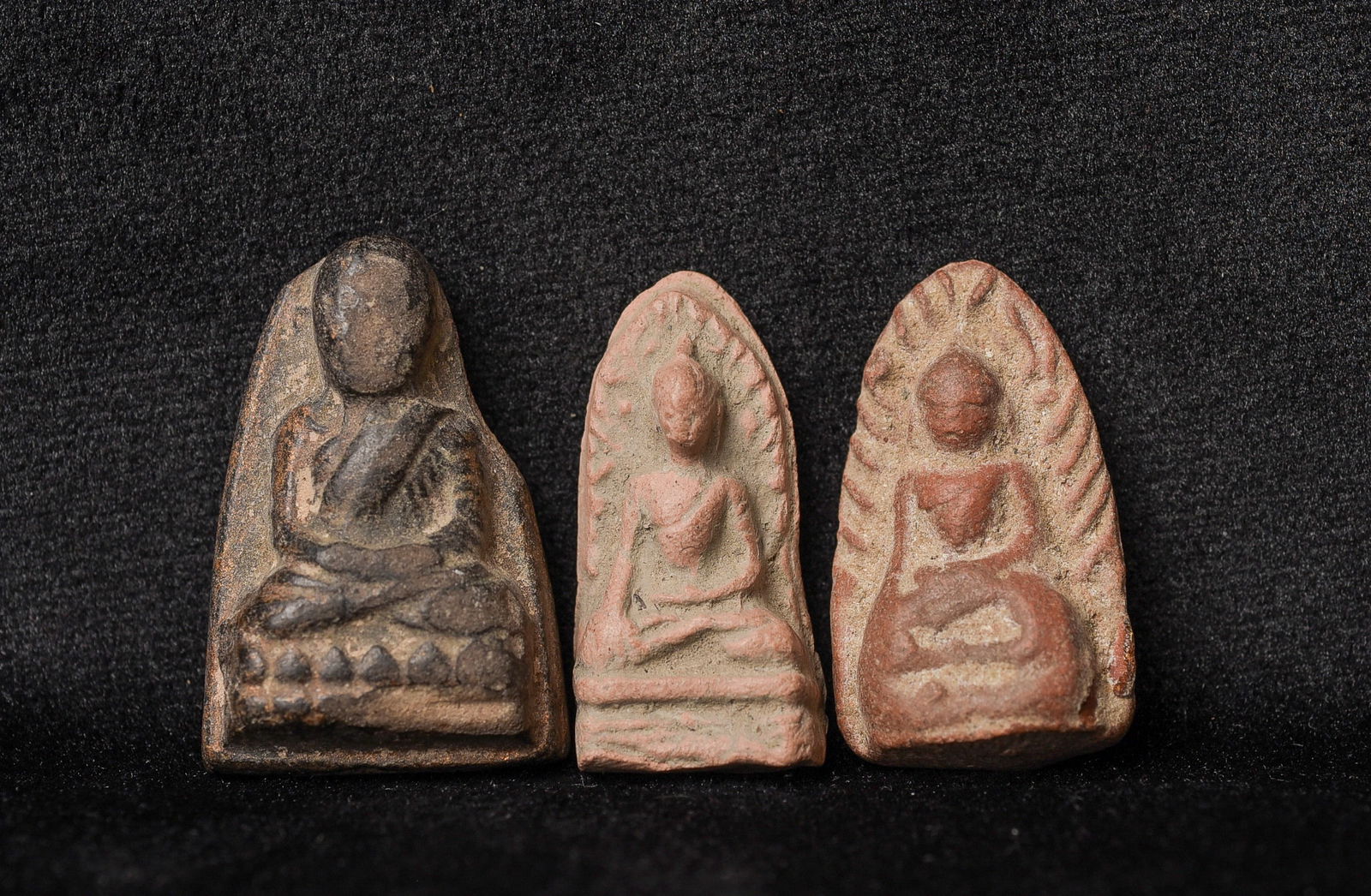 THREE antique Thai amulets from a major collection.: THREE antique Thai amulets from a major collection of a lifelong collector of Buddhist amulets and tablets and other small items, primarily from southeast Asia. Out of all of the collections I have pu