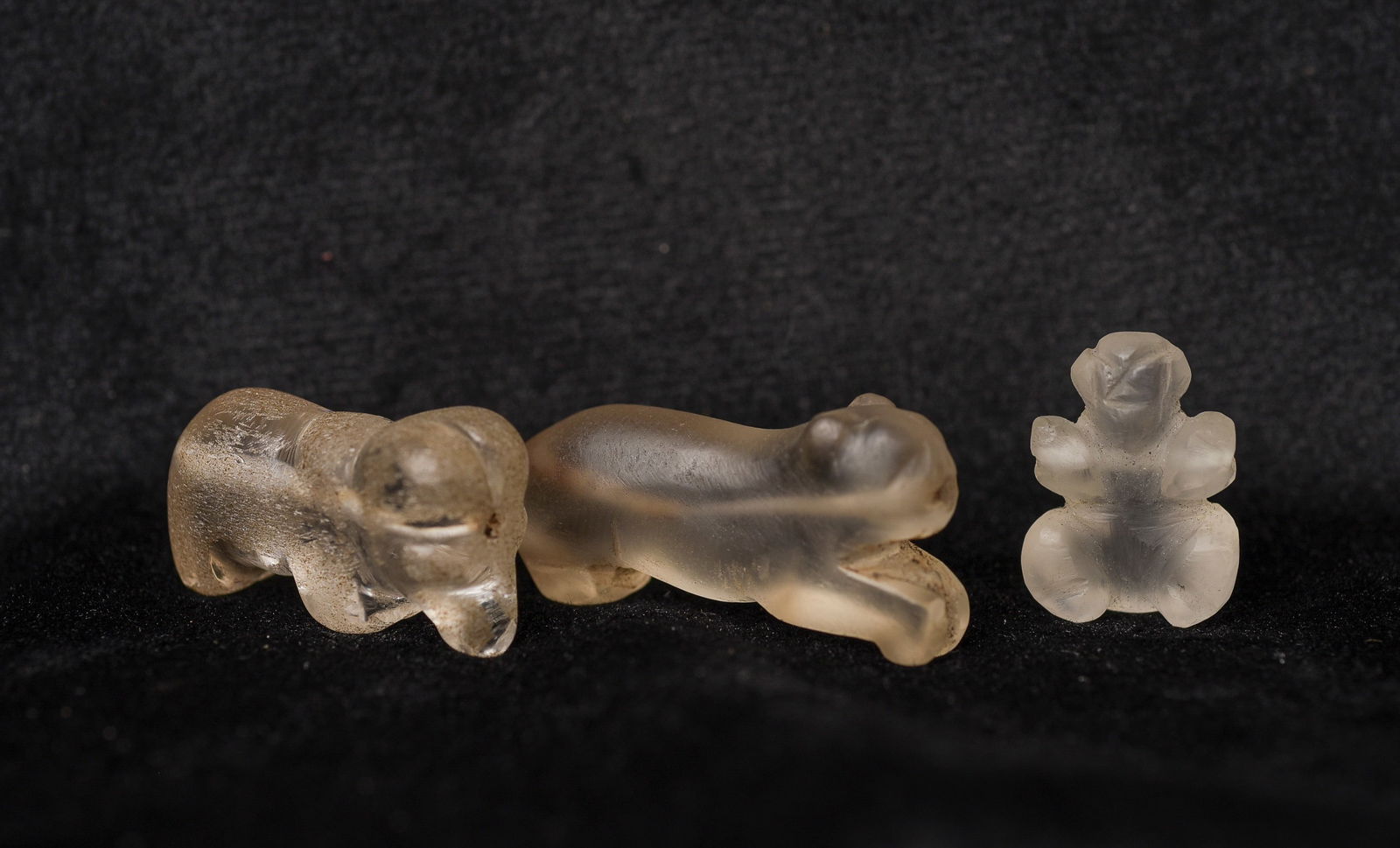 Group of 2 Pyu beads quartz or ancient glass beads of mythical animals.: Group of 2 Pyu beads, quartz or ancient glass beads of mythical animals, plus one other mystery bead also carved out of quartz/ancient glass. Purchased on the Burmese border in the 1990's. I sold the