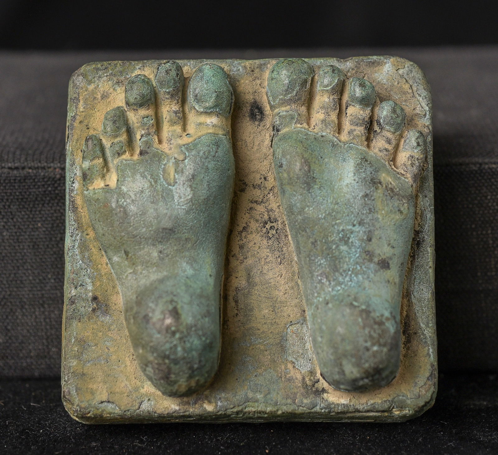 Early "Feet of the Buddha" purchased from a collector who mostly collected early Buddhist bronze: Early "Feet of the Buddha" purchased from a collector who mostly collected early Buddhist bronze items. The casting is remarkable-the gentle curves in the feet are far more sophisticated than I've eve