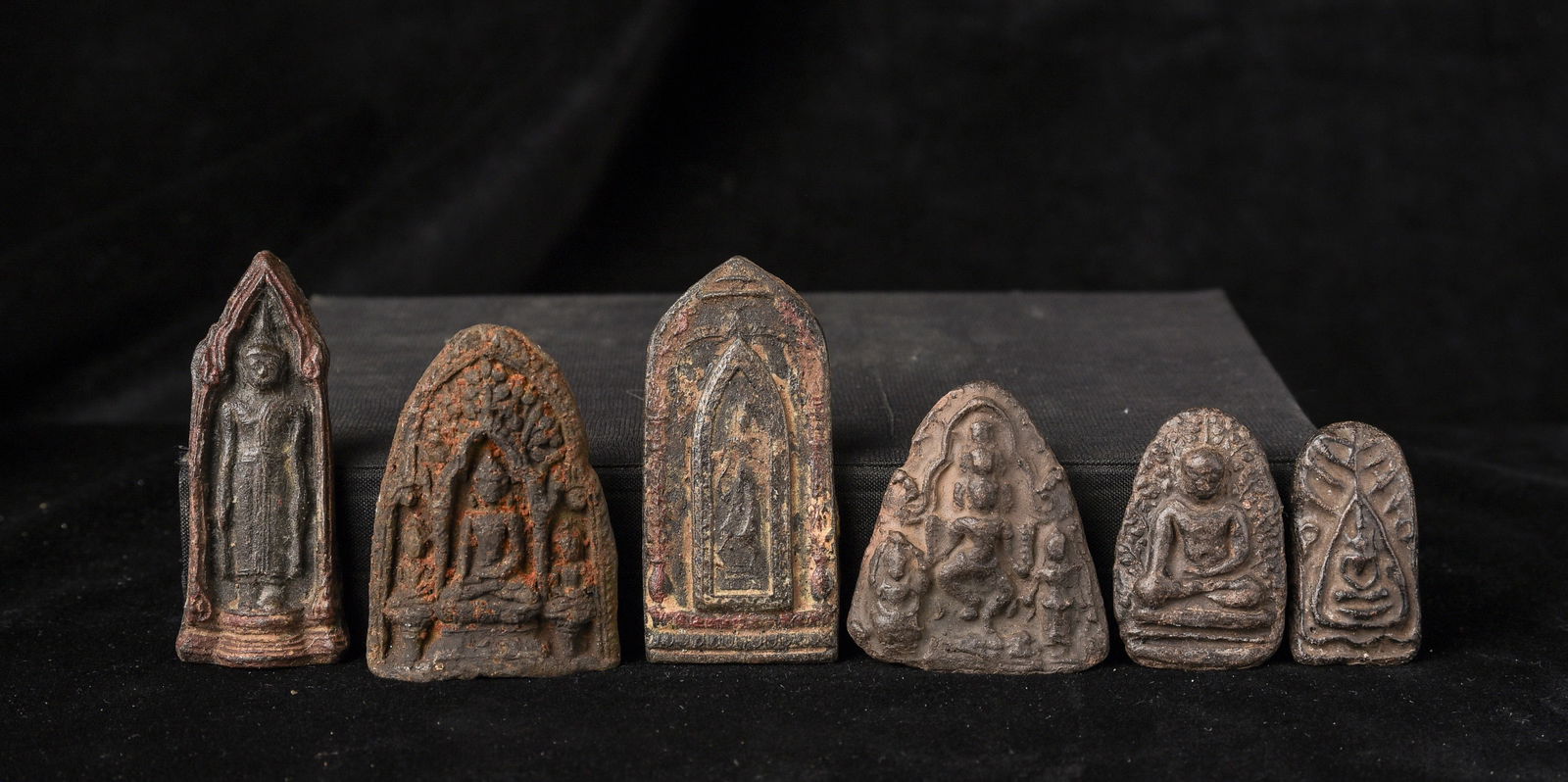 A group of 6 (Southeast Asian-Thai?) Amulets, some antique.: A group of 6 (Southeast Asian-Thai?) Amulets, some antique. They came together from an estate, so I am selling them together as a group. I am unfamiliar some of them, and I think a few may be correct.