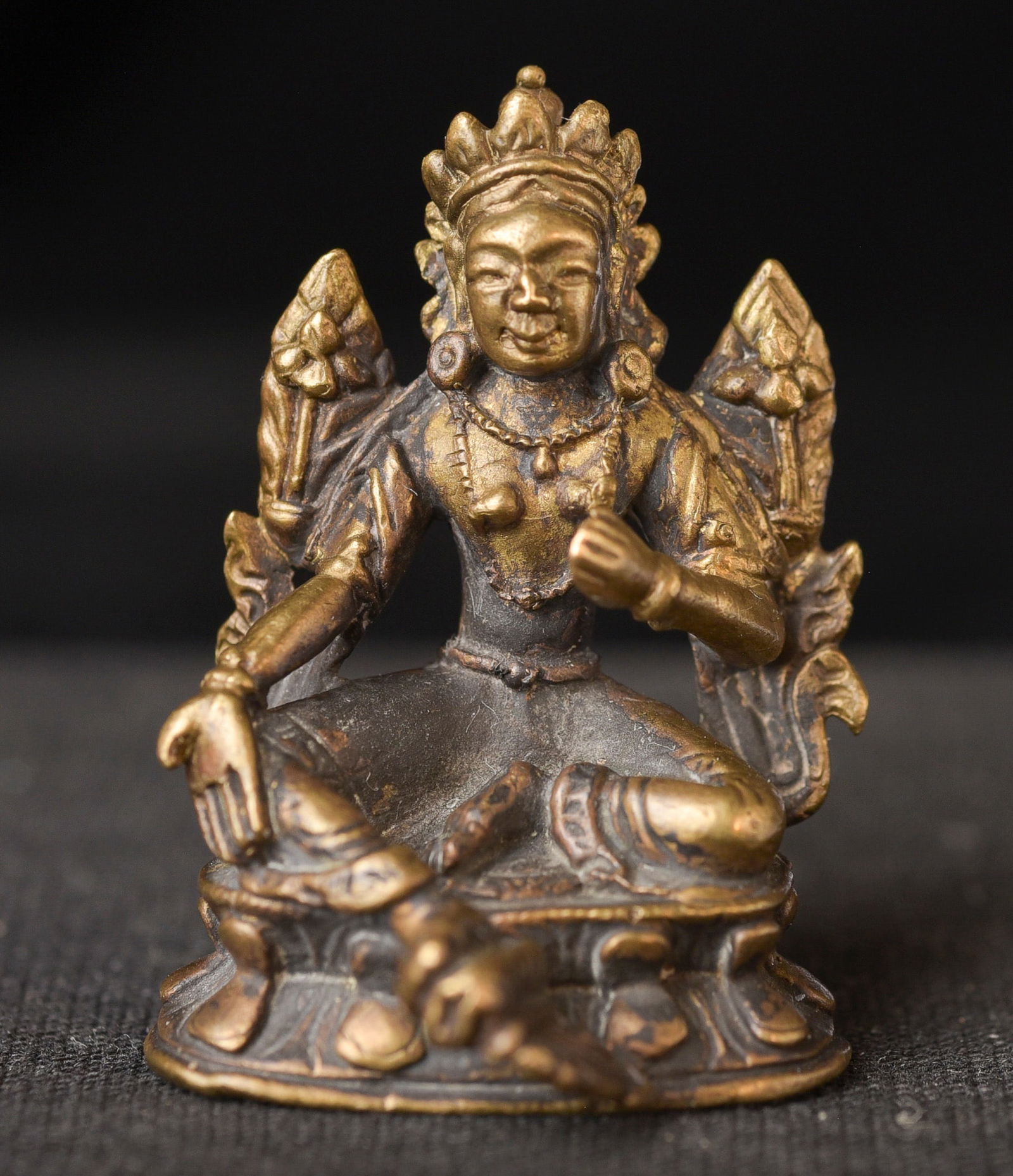 Miniature 18/19thC bronze Buddha in giving Mudra.: Miniature 18/19thC bronze Buddha in giving Mudra. The sealed bottom has something inside which rattles when you shake it. Could be Mongolian or Chinese - ( 1.375"H x 1"W x 1"D ) - 30g. Deep discount.