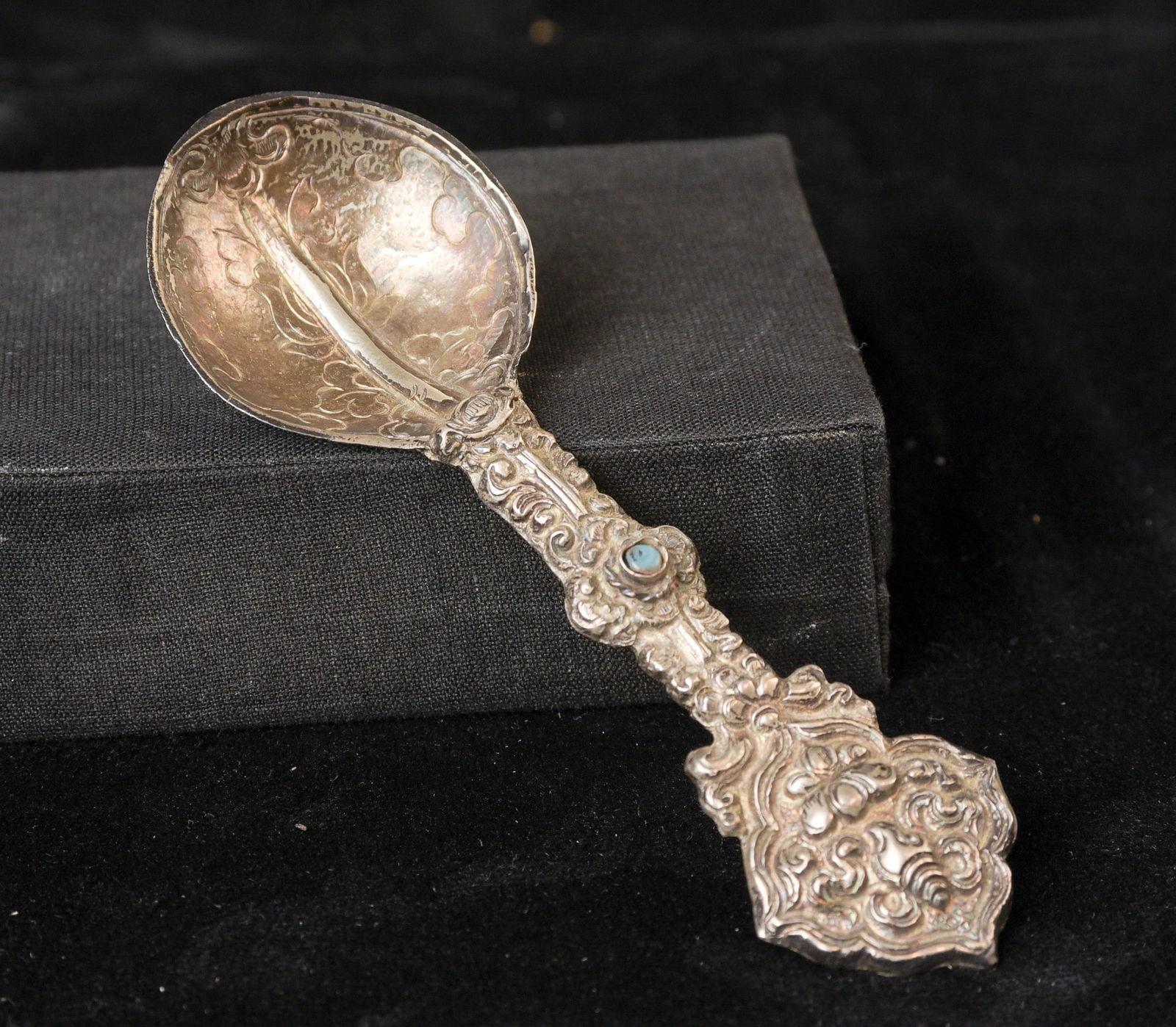 Indian handcrafted silver anointing spoon with in laid stone.: Indian handcrafted silver anointing spoon with in laid stone. Nice example.( 4.75"H x 1.5"W ) - 20.