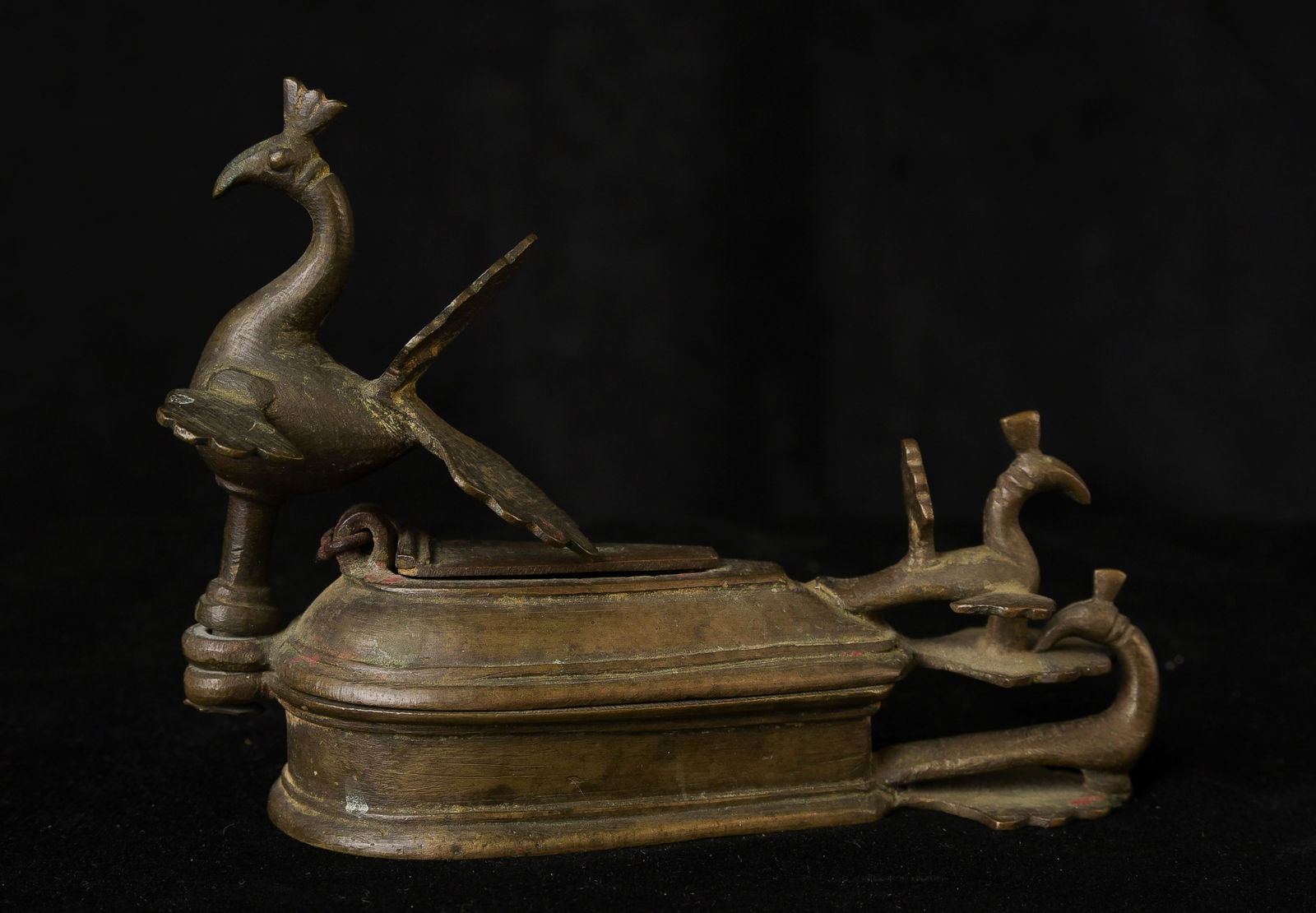 Antique Indian brass or bronze ritual, cosmetic holder or object for holding other powders or: Antique Indian brass or bronze ritual, cosmetic holder or object for holding other powders or potions that cleverly closed by having a nice weekend peacocks swivel on the tops. I?ve seen much simpler