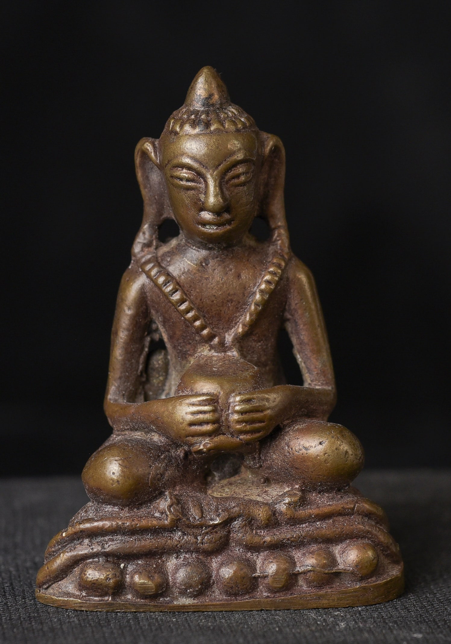 Miniature bronze south east Asian Buddha. Probably Laos, though unsure.: Miniature bronze south east Asian Buddha. Probably Laos, though unsure.( 2"H x 1.375"W) - 50g.