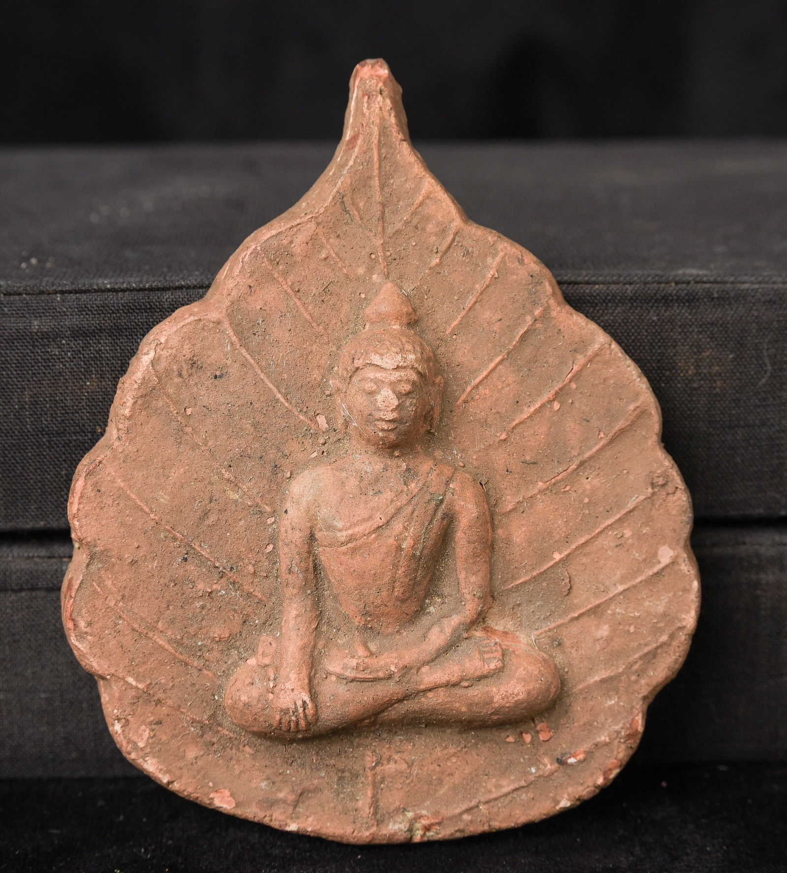 19thC Burmese Buddha in a leaf background- rare type.: 19thC Burmese Buddha in a leaf background- rare type- almost 4 inches- flattened nose- otherwise great shape. - ( 4"H x 3.25"W x .75D ) - 100g