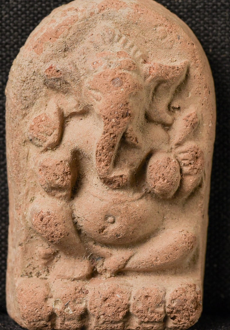 Thai 19thC Clay Amulet of Ganesh. Rattanakosin period.: Thai 19thC Clay Amulet of Ganesh. Rattanakosin period. ( 1.5" H x 1"W x .5"D ) - 10g.