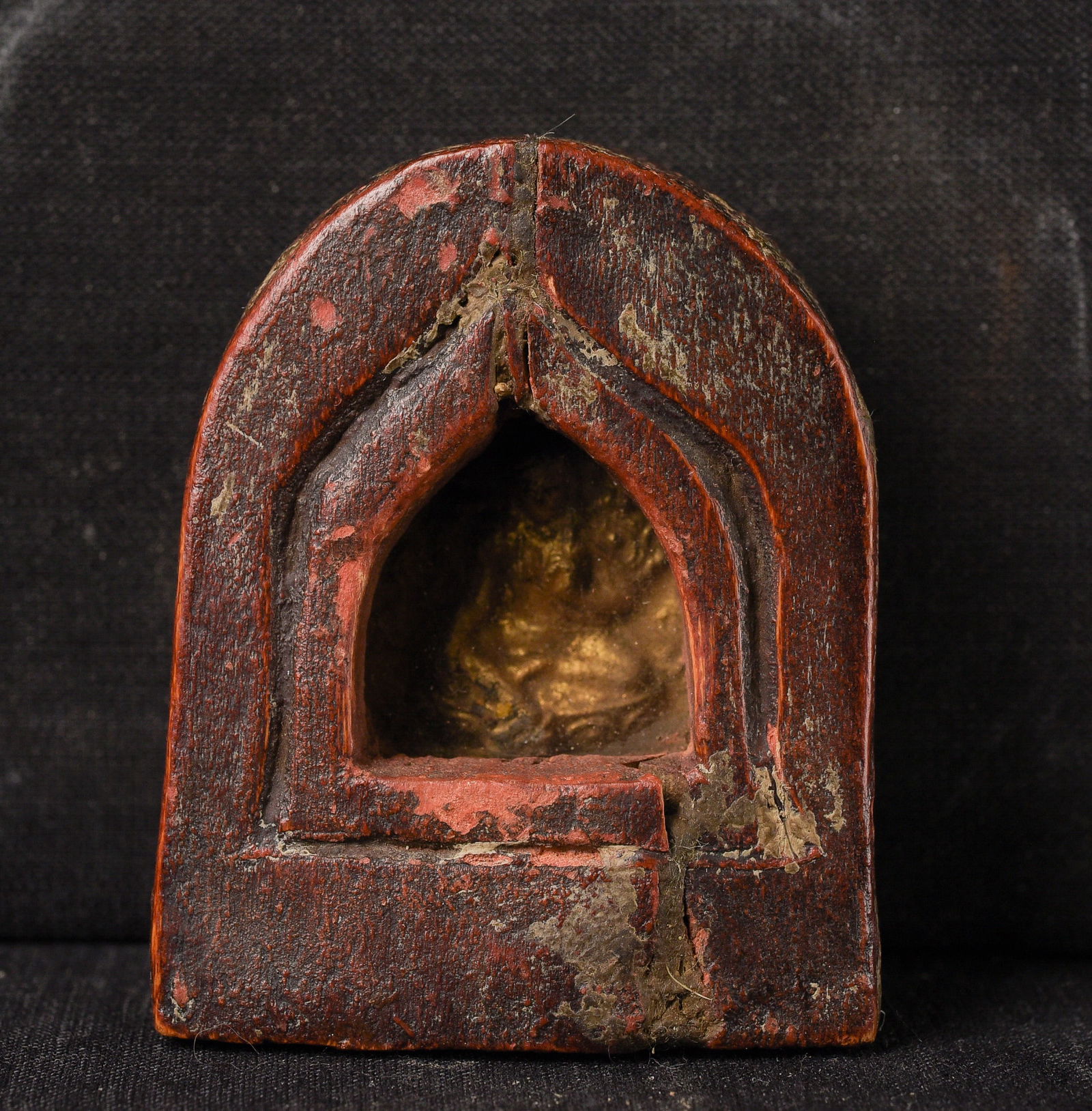 Antique Mongolian gilt clay amulet in wooden gau.: Antique Mongolian gilt clay amulet in wooden gau. ( 2.25" H x 2"W x 1.25"D ) - 40g.