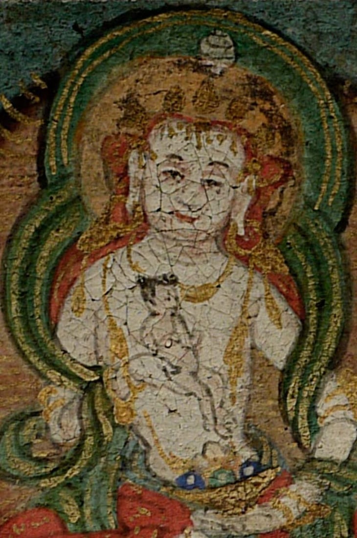 This amazing antique tiny thangka is 1 1/16" x 1 5/16".: This amazing antique tiny thangka is 1 1/16" x 1 5/16". Notice that the Bodhisattva is holding a child.