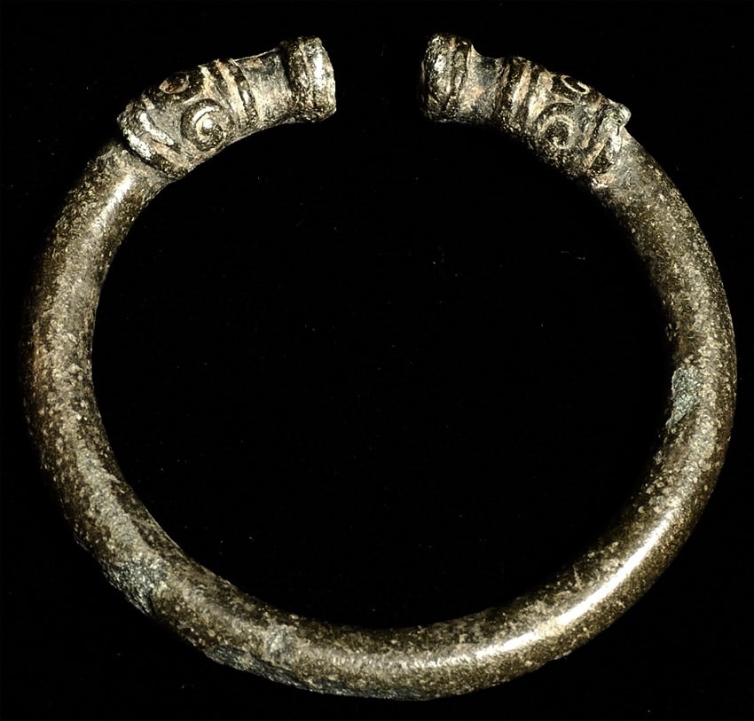 Khmer Bronze Bracelet w/ Dragon Ends: Khmer bronze bracelet with stylized dragon ends (for a very small person). Probably 800 to 1000 years old. Nice patina. 2.5 inches at its widest outermost point. It has a superb patina of the highest