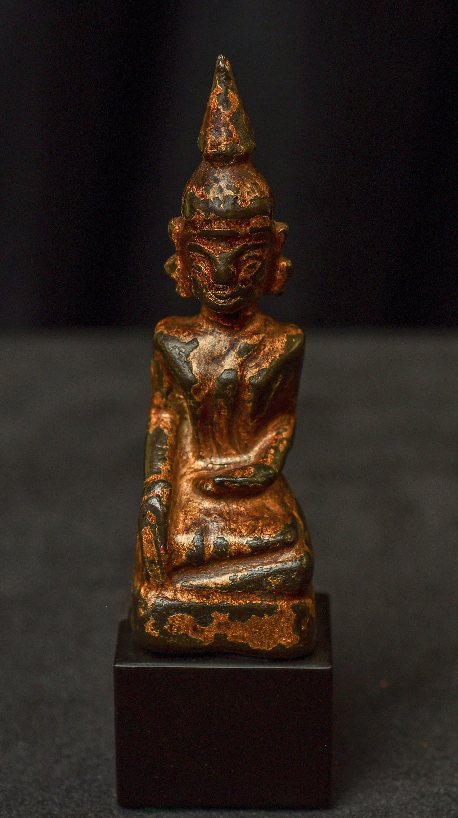 18thC/Earlier Laos Buddha on a modern base. Well cast, with remains of gilding.: 18thC/Earlier Laos Buddha on a modern base. Well cast, with remains of gilding.