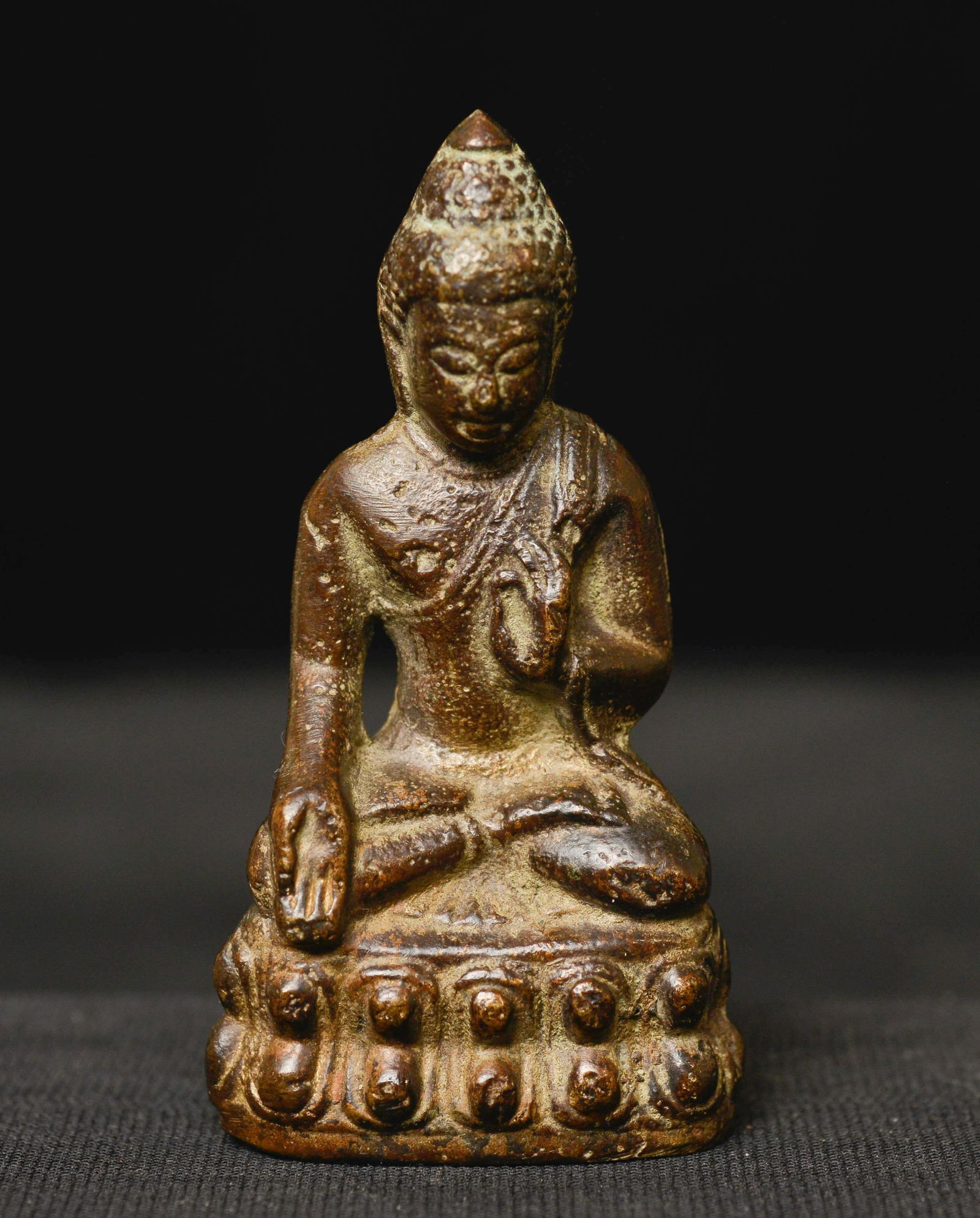 Old Thai or Chinese bronze Buddha. Sits 2 5/8 inches tall.: Old Thai or Chinese bronze Buddha. Sits 2 5/8 inches tall. Has something inside that makes a rattling sound when you shake it.