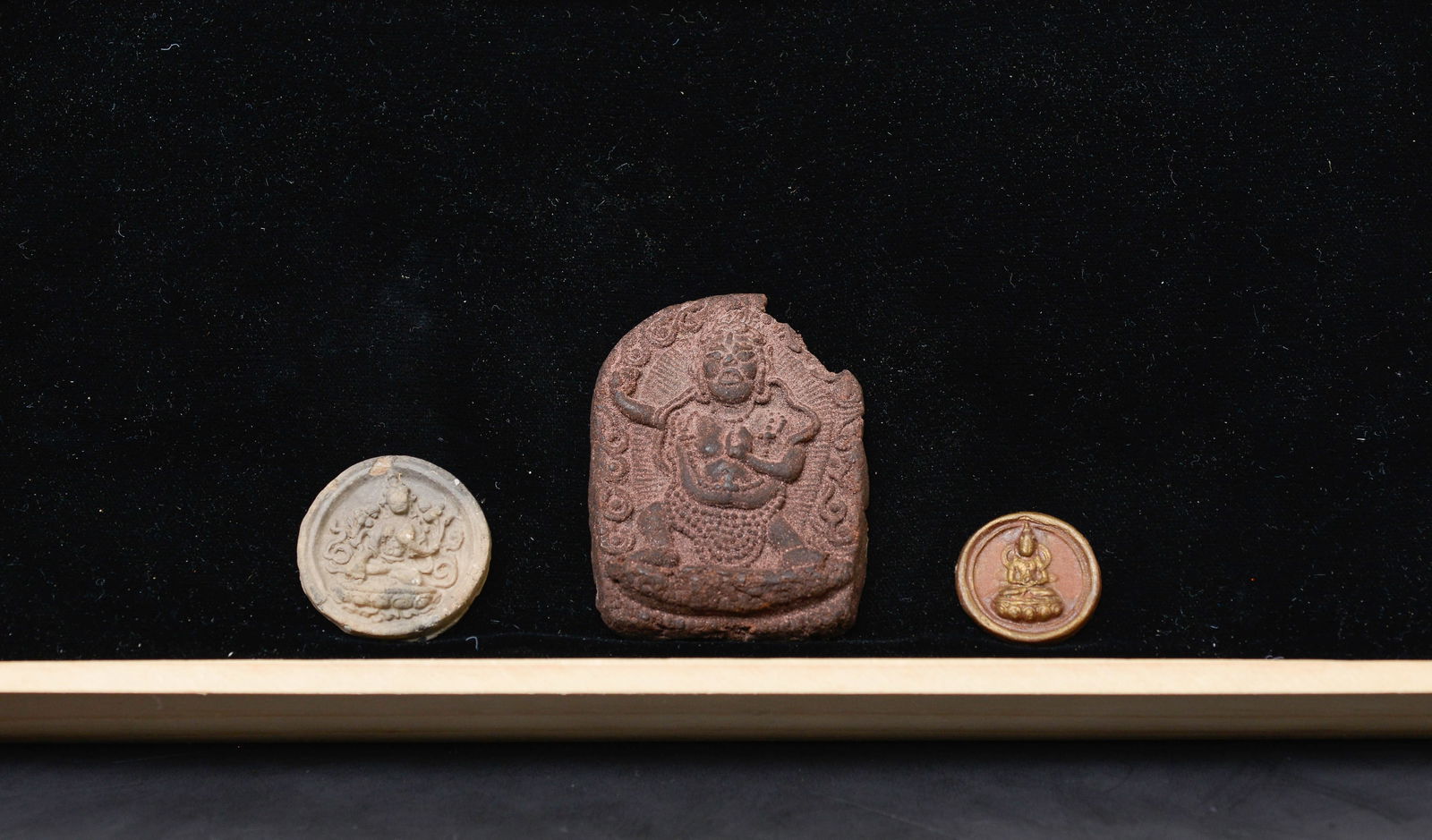 Box Lot #3 This Box lot consists of three Tibetan or Mongolian Clay Buddhist Tsa Tsas.: Box Lot #3 This lot consists of three Tibetan or Mongolian Clay Buddhist Tsa Tsas. One has some loss, one a small chip, and the round one is fine and perfect and could have been sold for more than the