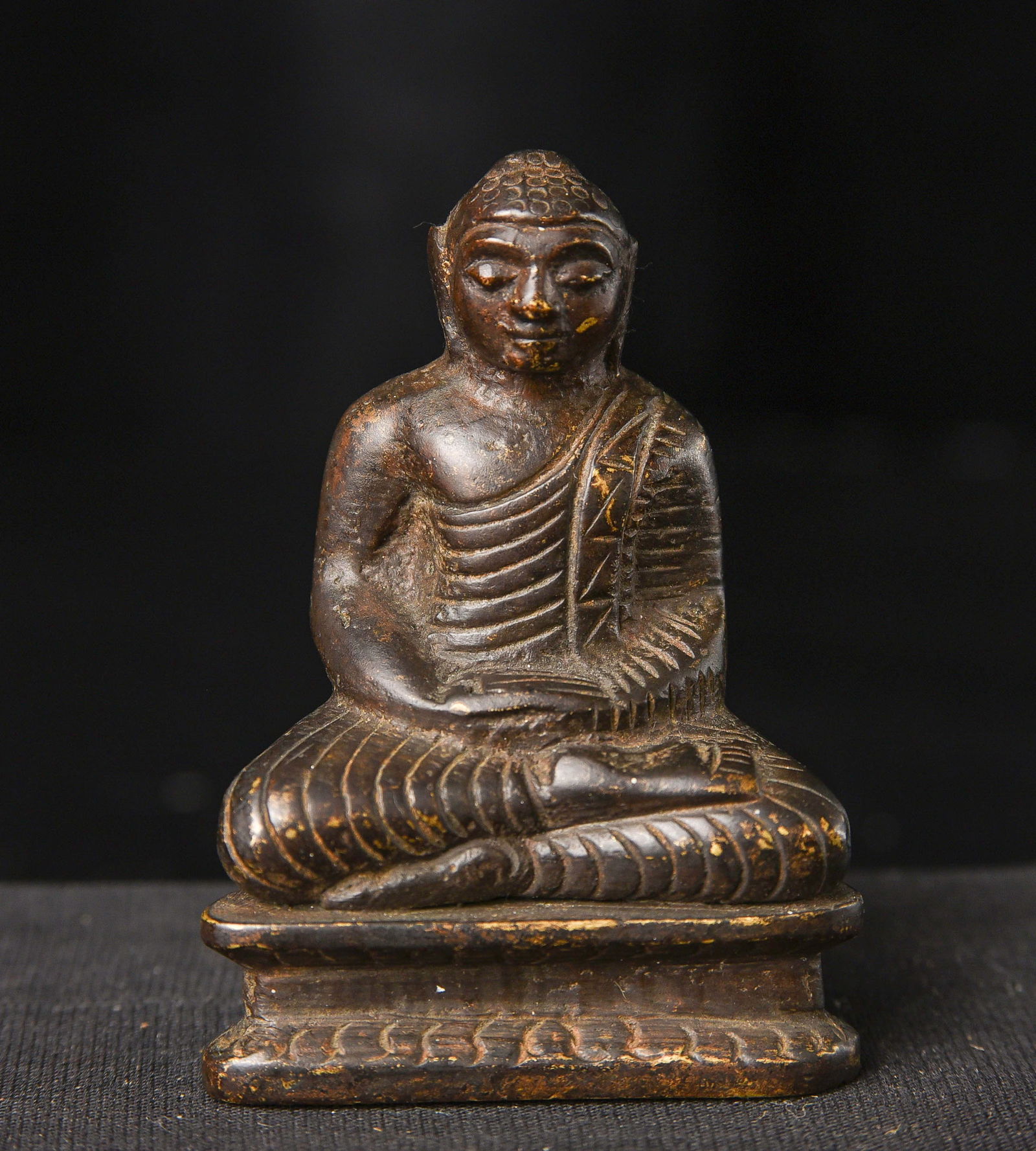 Sri Lankan bronze Buddha.: Sri Lankan bronze Buddha. In a very early style. Looks to have originally been gilded. Likely 18/19thC but possibly much earlier. 2 5/8 inches tall. Same type as Item #6639 Deep discount.
