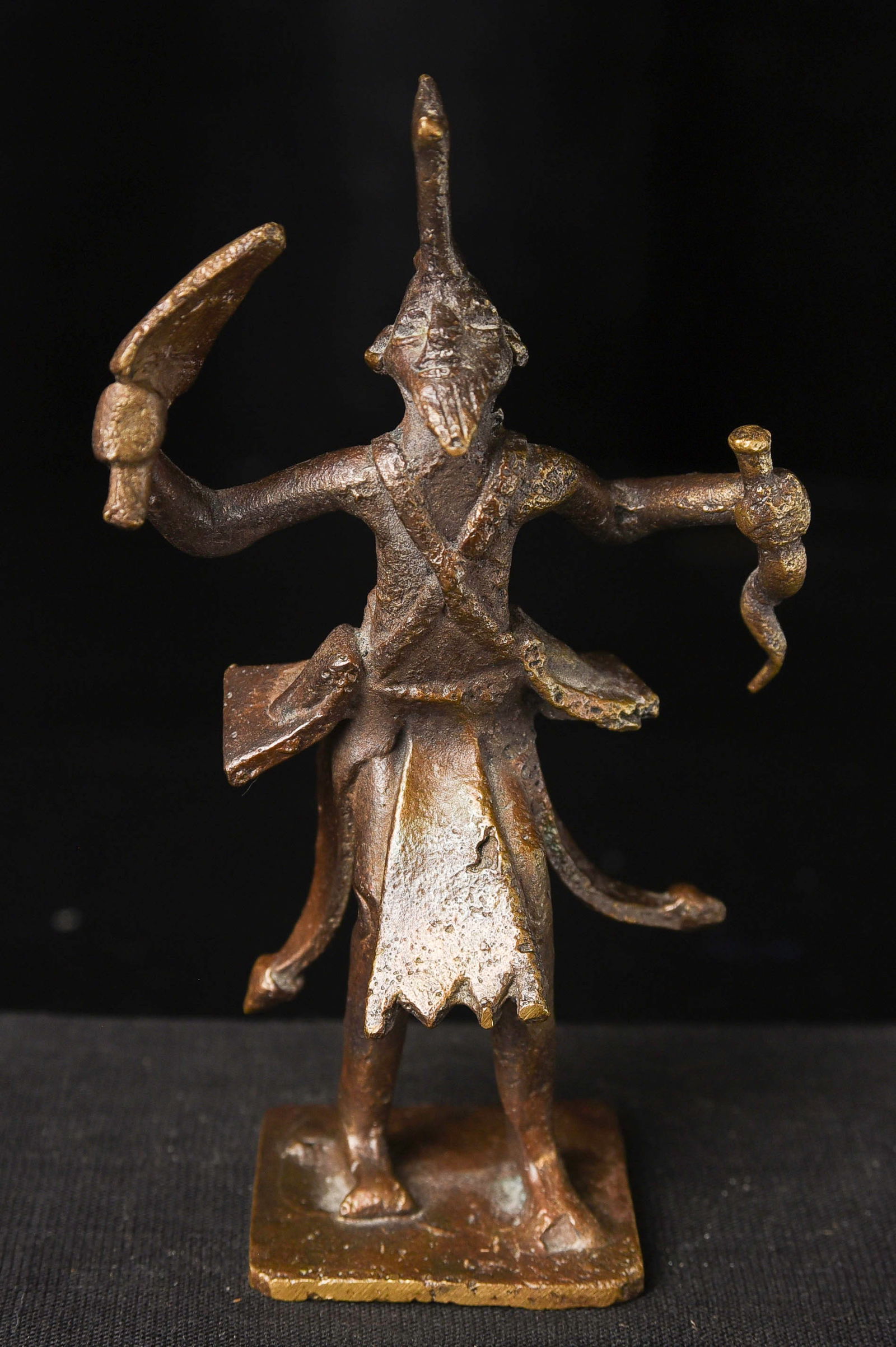 Powerful vintage/old Indian bronze figure.: Powerful vintage/old Indian bronze figure. Looks like an emulation of a very early form of Shiva- Proto-Siva, with a lightening bolt through his head. 4.25" tall, 2.25" wide, 1.25" deepDomestic packin