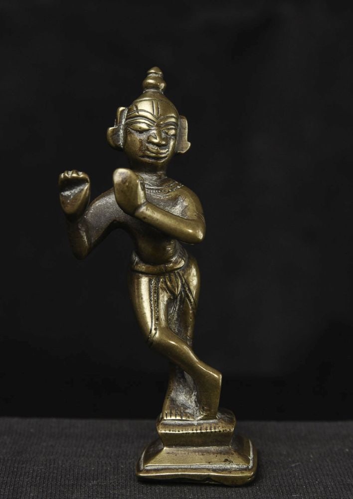 Krishna. 3-5/8" tall.: Krishna,Interesting expression. (3.625"H x 1.25"W x 1.125"d) - 125g