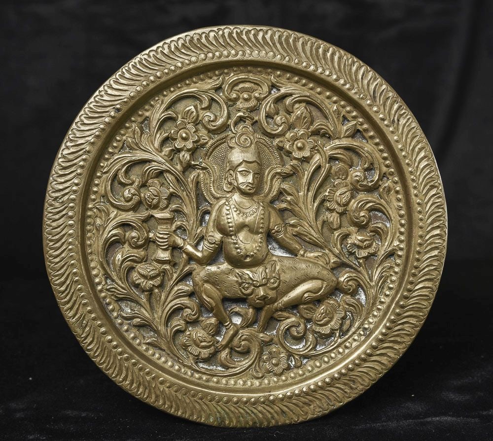 Antique Indian figure sculpted into a pierced copper plate.: An interesting Indian figure sculpted into a copper plate. Has age to it. (6.125"diameter ) - 240g