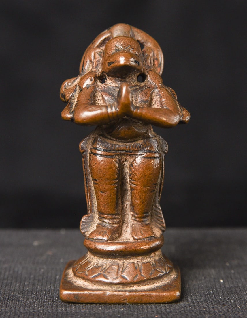 Miniature in size, but resolute in stance, this 17thC solid cast bronze Hanuman stands with an open (1 of 7)
