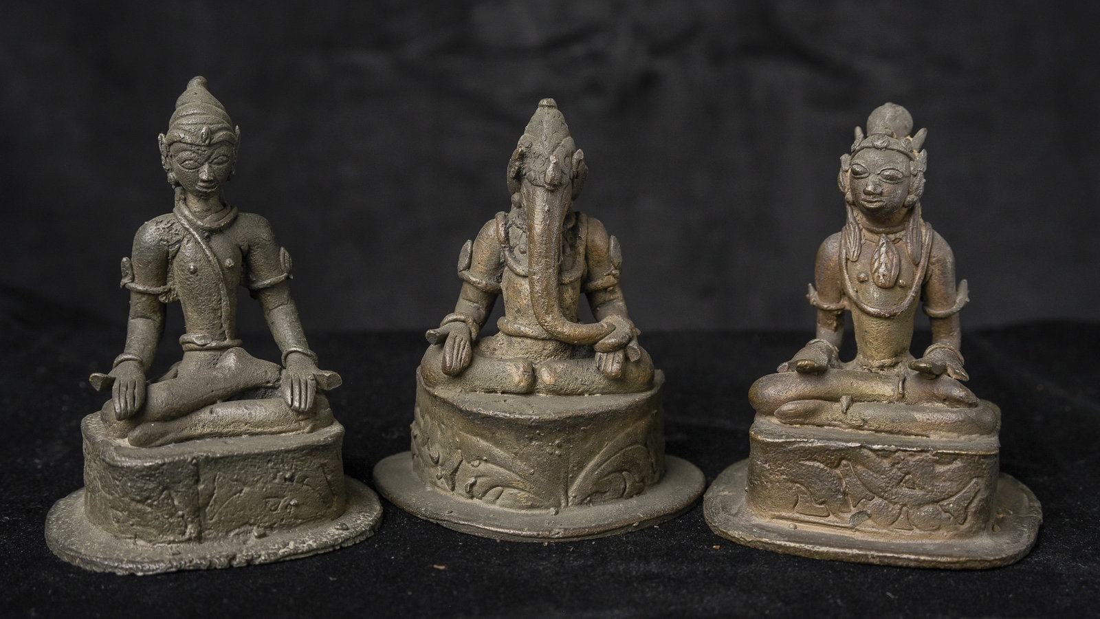 Antique Bronze Indonesian trilogy Buddha, Ganesh, Goddess of Rice: This auction is for a near-set of bronzes from Java (Indonesia). In this Area, Buddhism, The Hindu Religion and local religion mixed together. This group is a perfect illustration. One is a buddha, on