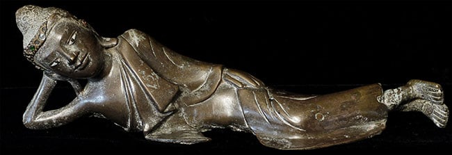 19thC solid-cast reclining Burmese Buddha. - 2