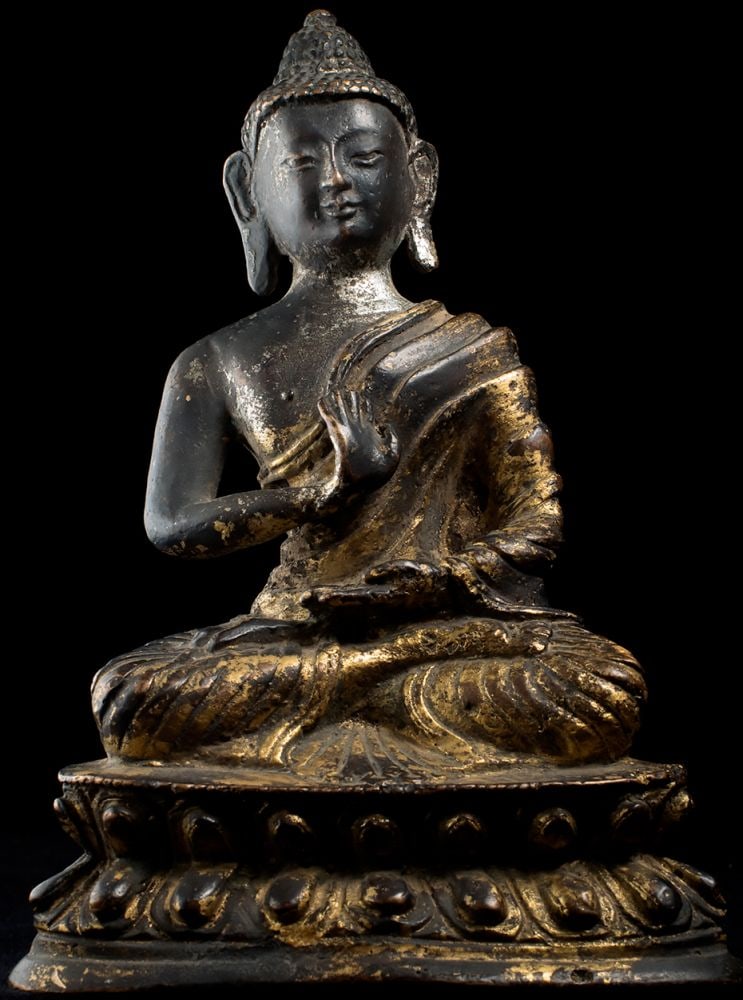 Tibetan Buddha with remains of gilding. Unusual ripples (1 of 6)