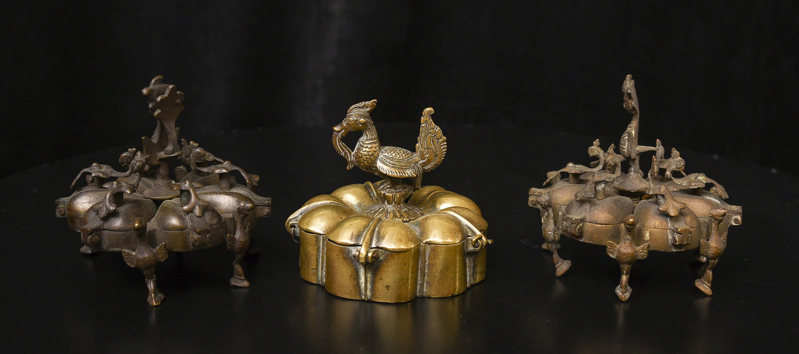 Three antique Indian bronze containers, each about 3" high, diameters of 3-1/8". Some losses as seen: Three antique Indian bronze containers, each about 3" high, diameters of 3-1/8". Some losses as seen in the photos.