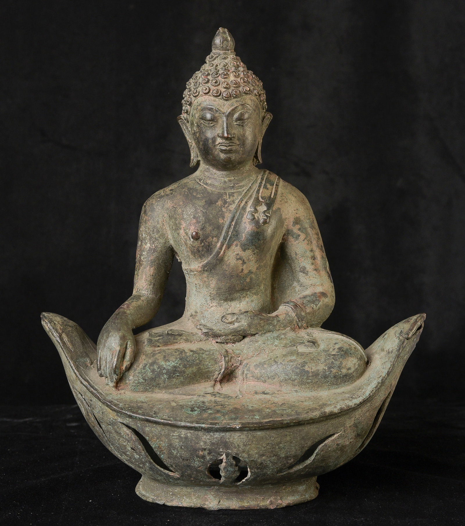 18 /19 century or earlier northern Thailand, Lanna style Buddha sitting on a boat shaped base.: 18 /19 century or earlier northern Thailand, Lanna style Buddha sitting on a boat shaped base. ``this also happens to be the shape of ancient Thai money. Many of this style are made in the 15/16