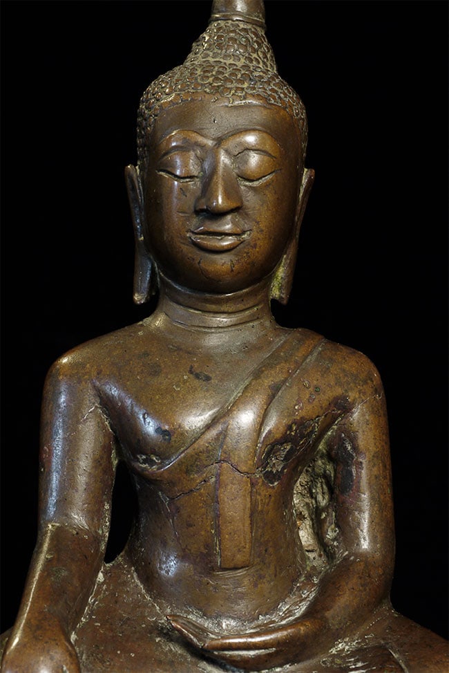 16thC Thai Buddha, Wonderfully Expressive, 7": Delightful 16thC Thai Buddha. Some casting flaws and back leg repaired. Wonderfully expressive. With is finial cocked to one side, he presents with great personality. Sits 7" tall