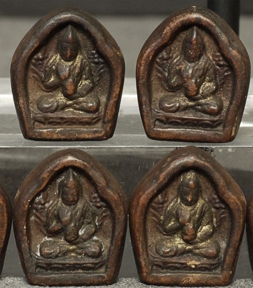 Very rare set of EIGHT miniature Tibetan or Mongolian Buddhist Tsa Tsa's.: Very rare set of EIGHT miniature Tibetan or Mongolian Buddhist Tsa Tsa's. These are particularly valuable as they are so small at only .75 inch tall each that they would be perfect to wear around the
