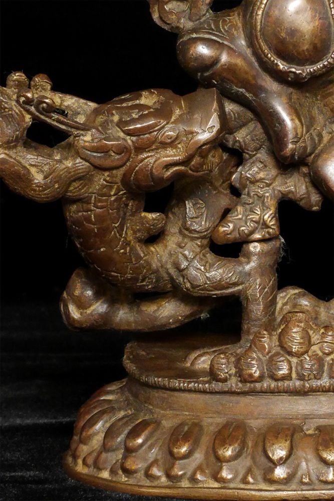 Antique Solid-cast Mongolian deity on dragon. - 4