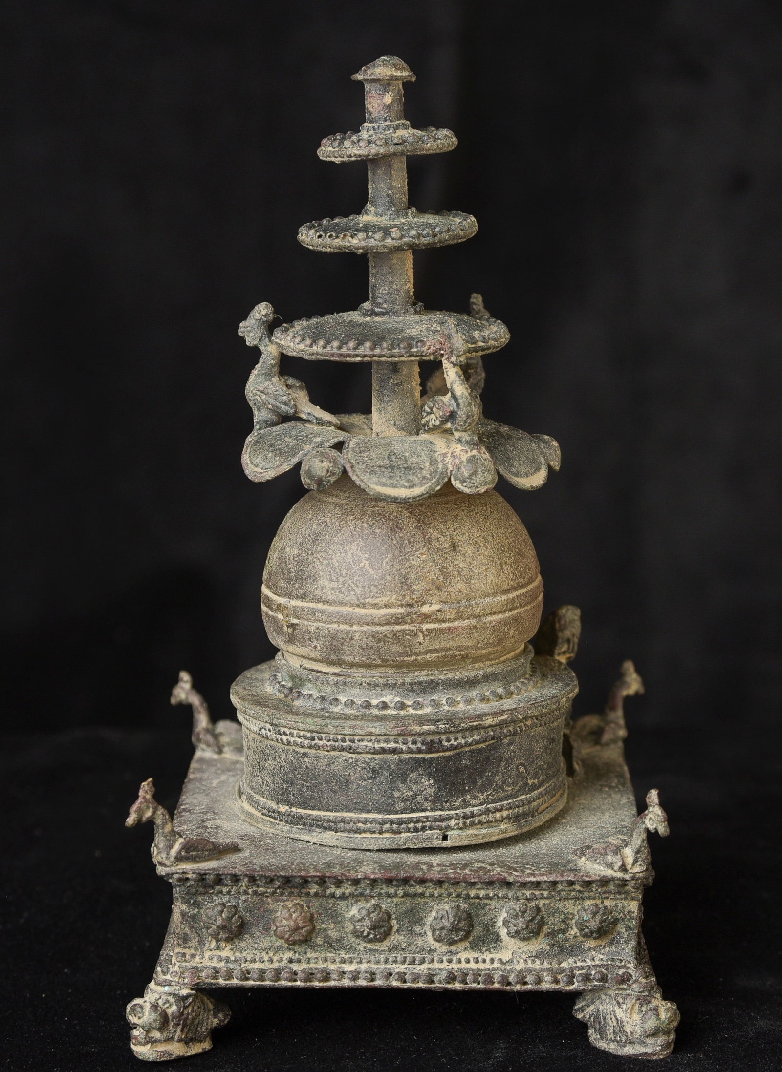 Bronze and ancient glass Buddhist Stupa, possibly in the style of Gandara.: Bronze and ancient glass Buddhist Stupa, possibly in the style of Gandara. The sections stack loosely together. I?ve never seen another of this type other than this one, a group of four slightly