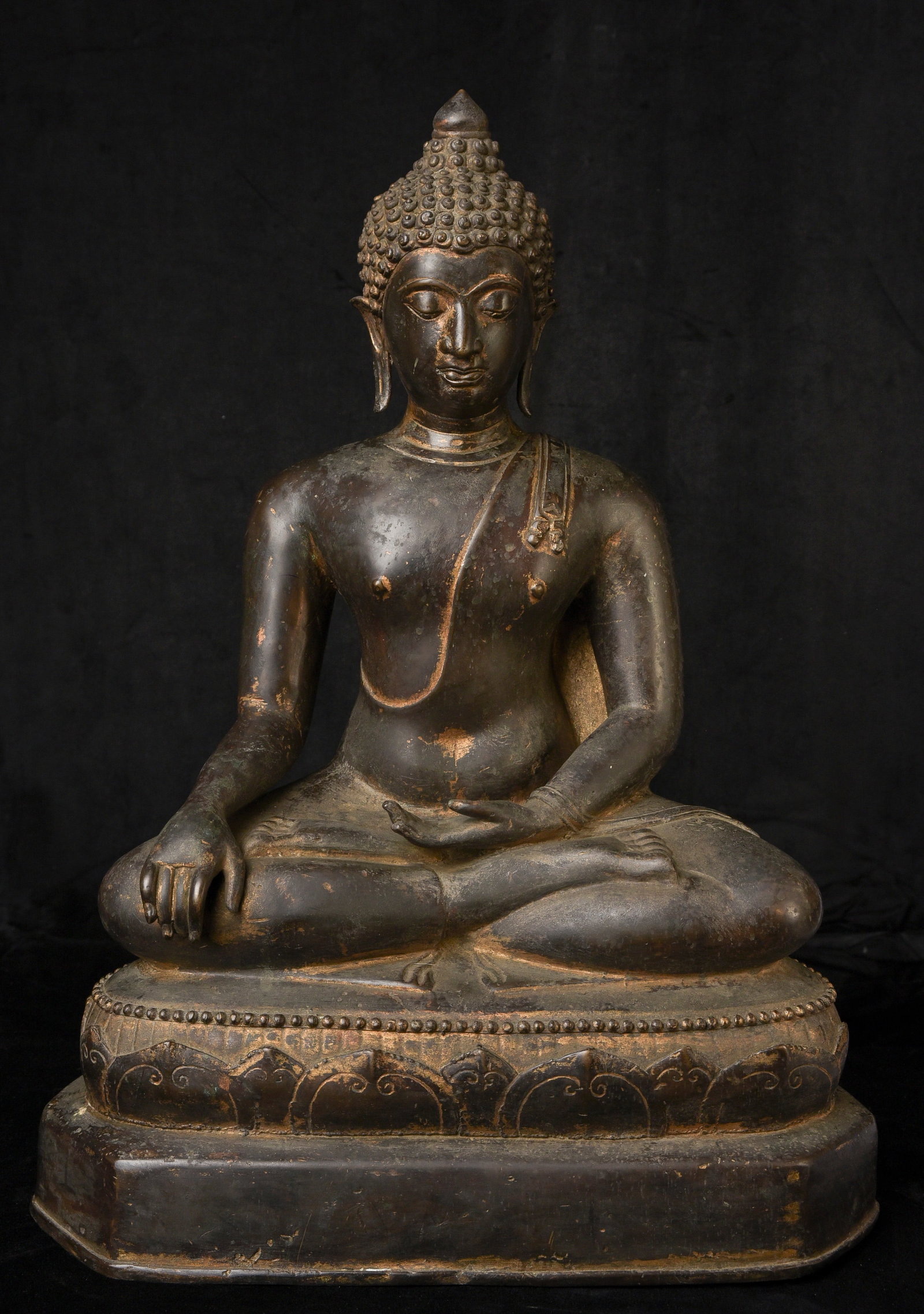 19th century northern Thai Buddha? cast in the traditional way: 19th to the beginning of the 20th century northern Thai Buddha. believe it is an authentic northern Tha Buddha. It is quite large substantial at ( 18.5"H x 14"W x 8.25"D ) - it looks to have been