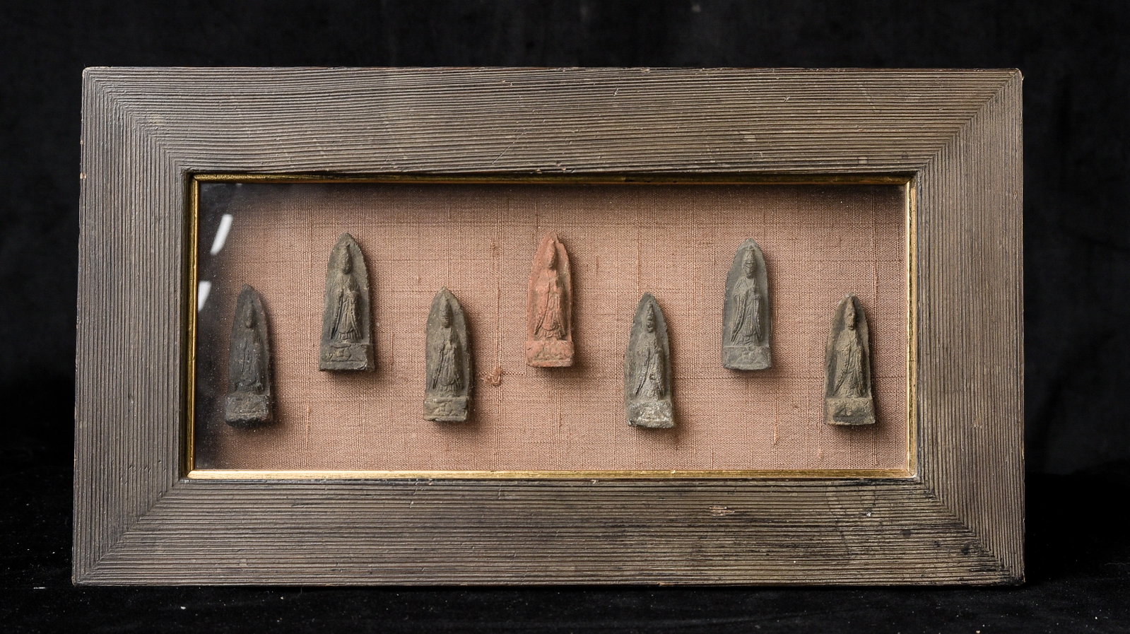 Set of 7 matched early (Pre-Tang- in the range of FIFTEEN HUNDRED YEARS OLD) Chinese clay/terracotta: Set of 7 matched early (Pre-Tang- in the range of FIFTEEN HUNDRED YEARS OLD) Chinese clay/terracotta Bodhisattvas. (Beautifully) framed size is 11.75" x 6.5. Each figure is approximately 1.75" tall.