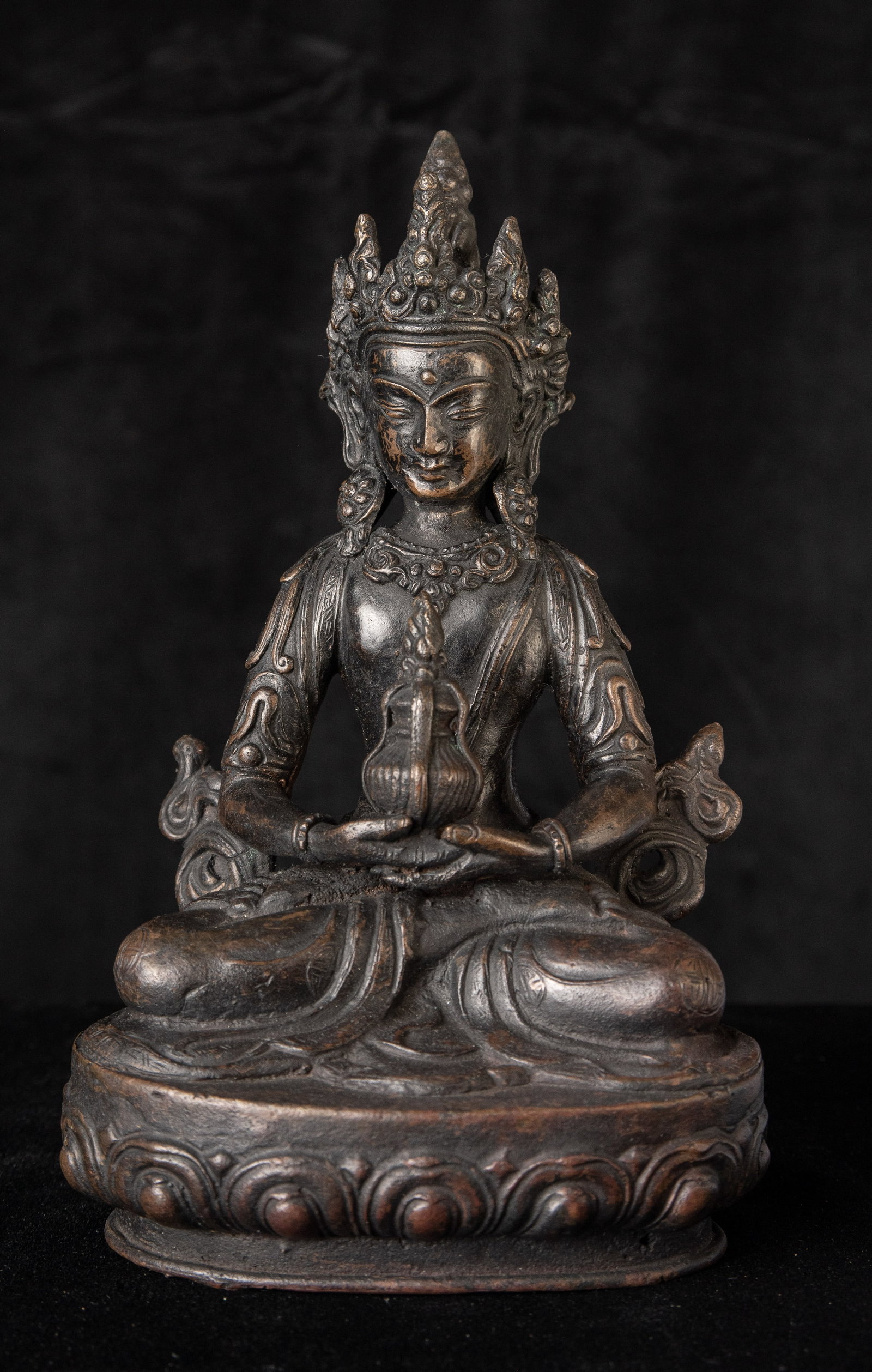 Older Nepalese Bodhisattva of Long Life (Amatayus). Very well-cast example. Good size at 7.75 inches: Older Nepalese Bodhisattva of Long Life (Amatayus). Very well-cast example. Good size at 7.75 inches tall. Likely had a cap that covered/consecrated the underside for much of its life. (7.75"H x 5"W x