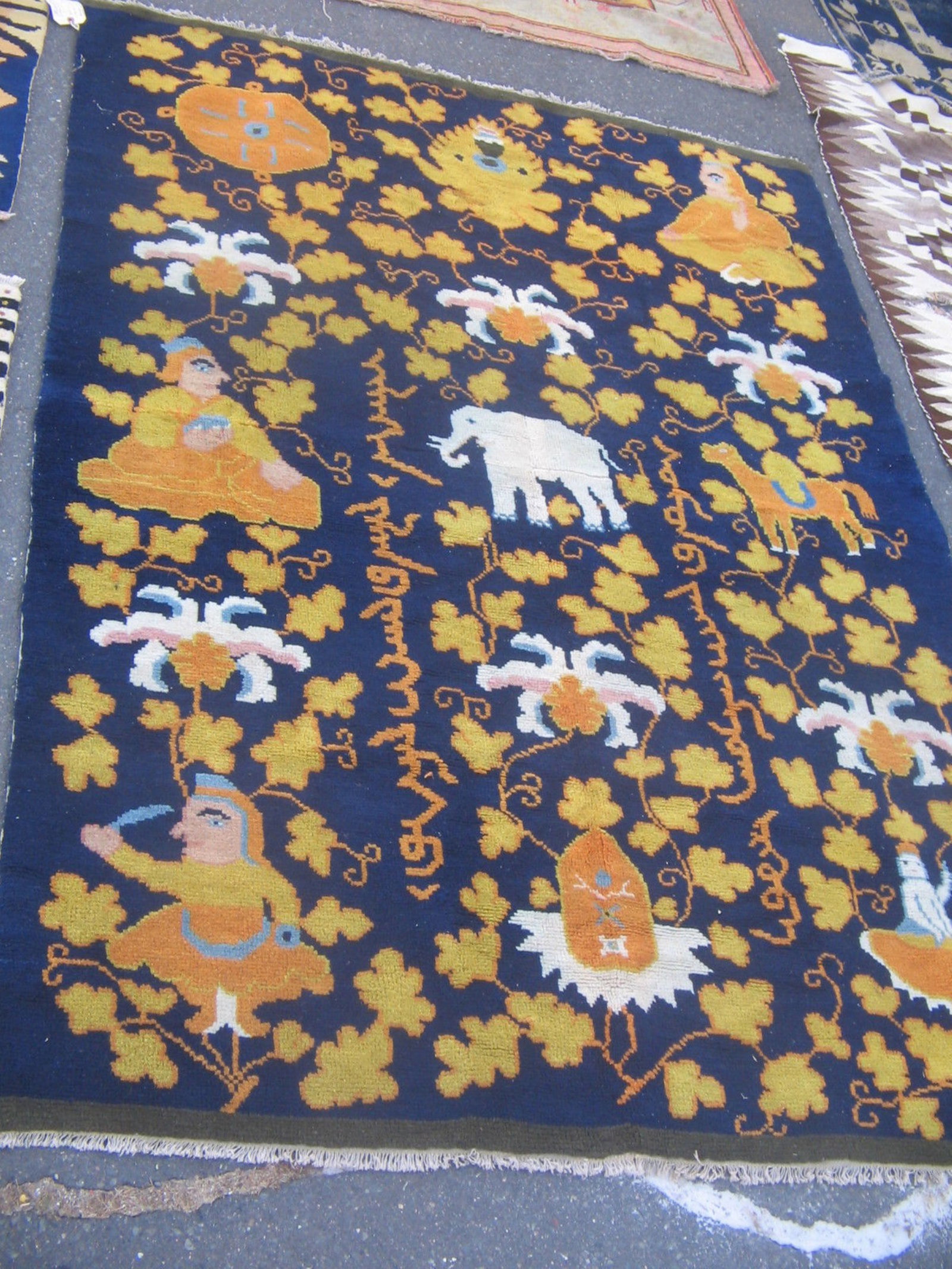 Vintage Unique Chinese Tibetan Rug -Look at photos!!: Antique Chinese Rug Probably Made for the Tibetan Market. Very unusual and lively type, with monks, animals, auspicious symbols, and flowers. Dimensions to follow. Some wear from use, but the overall