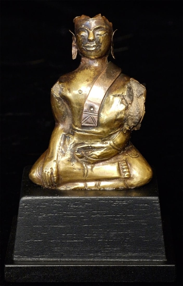 16thC Gold Buddha from Thailand Ayuthaya Style- Very rare type: Exceptionally rare 16/17thC Thai very high karat gold Buddha. Made by hammering a sheet/sheets of gold over a lay core in a repousse-like fashion. Unlike almost all the other examples of this type