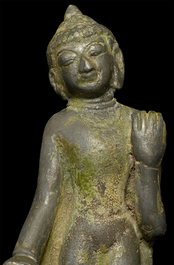 Rare 14/15thC Burmese Pagan Style Buddha: Rare Burmese Pagan style walking Buddha a lead/silver(?) alloy. Missing part of one hand. The neck is a little crooked, possibly because the alloy is so soft and because the head naturally leans to