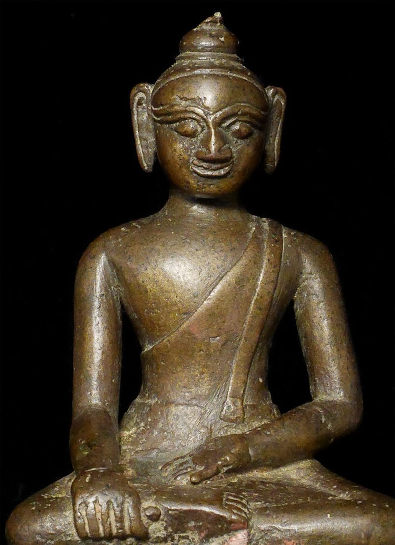 15th-17thCor earlier) Arakan Buddha.: 15th-17thc (or earlier) Arakan Buddha. Rare solid-cast type sits 4.75 inches tall, 5.75 inches on a custom stand. Wonderful face. Very skinny distinctive legs are a type typically found on early