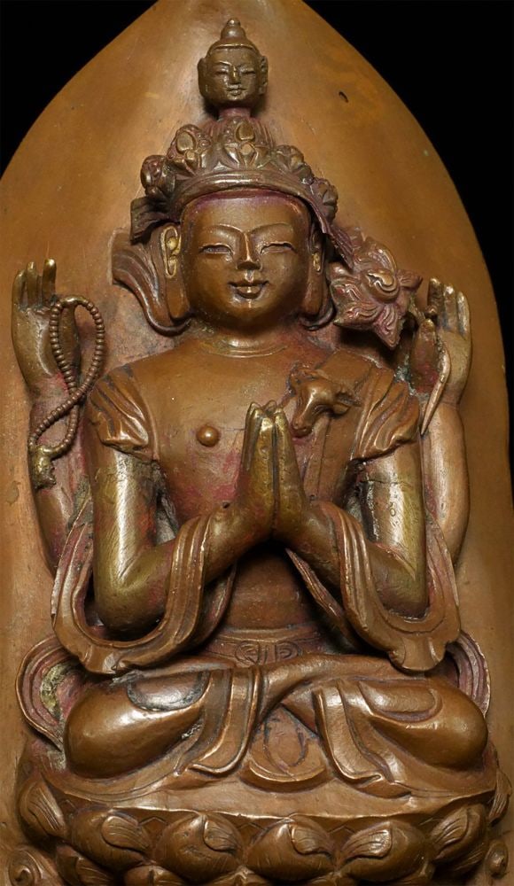 18thC Tibetan copper Repousse Bodhisattva on stylized: 18thC Tibetan copper Repousse Bodhisattva on stylized leaf.- Either from a lotus mandala or a Bodhisattva crown. I've seen several of these over the years. Slight damage to the crown, and would have