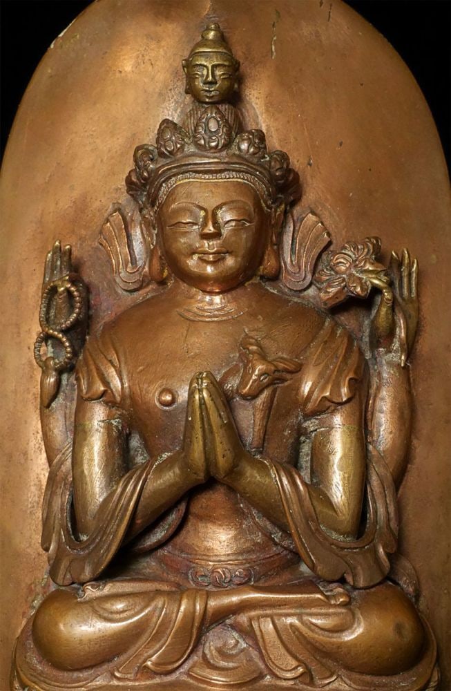Late 18thC/19thC Tibetan Copper Bodhisattva of compassion: Late 18th/19th Tibetan Copper Bodhisattva of compassion plaque with some parts cast out of bronze. Comes with a 19th/early 20th custom stand. I have sold several other related examples over the past
