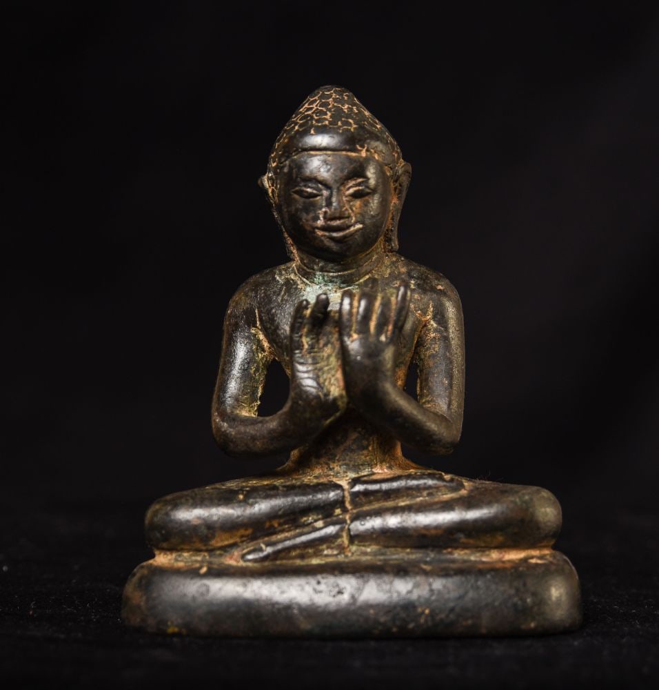 6-9thc. Style Burmese Pyu Style Bronze Buddha. 4.75" ( 12.065cm ): Burmese Pyu Style Bronze Buddha. 4.75" ( 12.065cm ) . The face is a bit unusual. I?ve not seen one quite like this before so I continue to research it. I keep vacillating between believing it is a